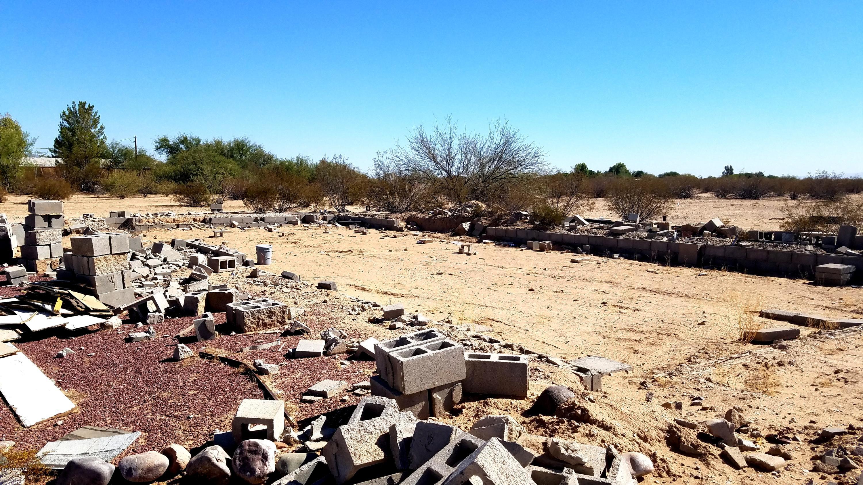 LEVEL 10 ACRE PARCEL WITH TWO ADDRESSES: 17055 and 17075. There was a MH set-up on the east 5 acres (a.k.a 17055) complete with septic, electric, telephone and a water meter. Septic was last re-certified in May of 2014. Mobile home has been removed. It was a doublewide mobile home. Water costs $10/mo. if you have not yet moved on. $50/mo when moved on and using the well.
