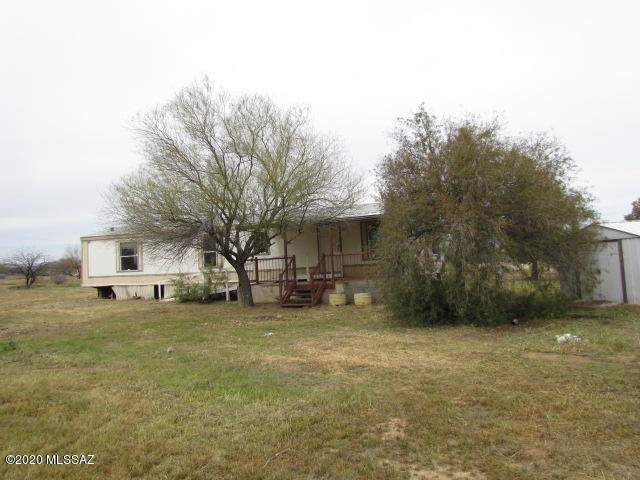 HUD Home. Save thousands.  Get out of town and enjoy country living.  Great value at a modest price.    Affordable 2-bedroom, 2 bath home.  Perfect for the budget minded., Located on over an acre lot with plenty of space for enjoying outdoor activities. Back patio and a covered front deck.  Fully fenced, with a RV hook up and 2 car carport.  City of Tucson water.   Some repairs needed.   Investors welcome to bid.  Call for your safe private showing.  Note buyers will be responsible for utility turn-on and any required permits for utility connect and re-winterization fee. Buyer to verify all info. Price Reduced!