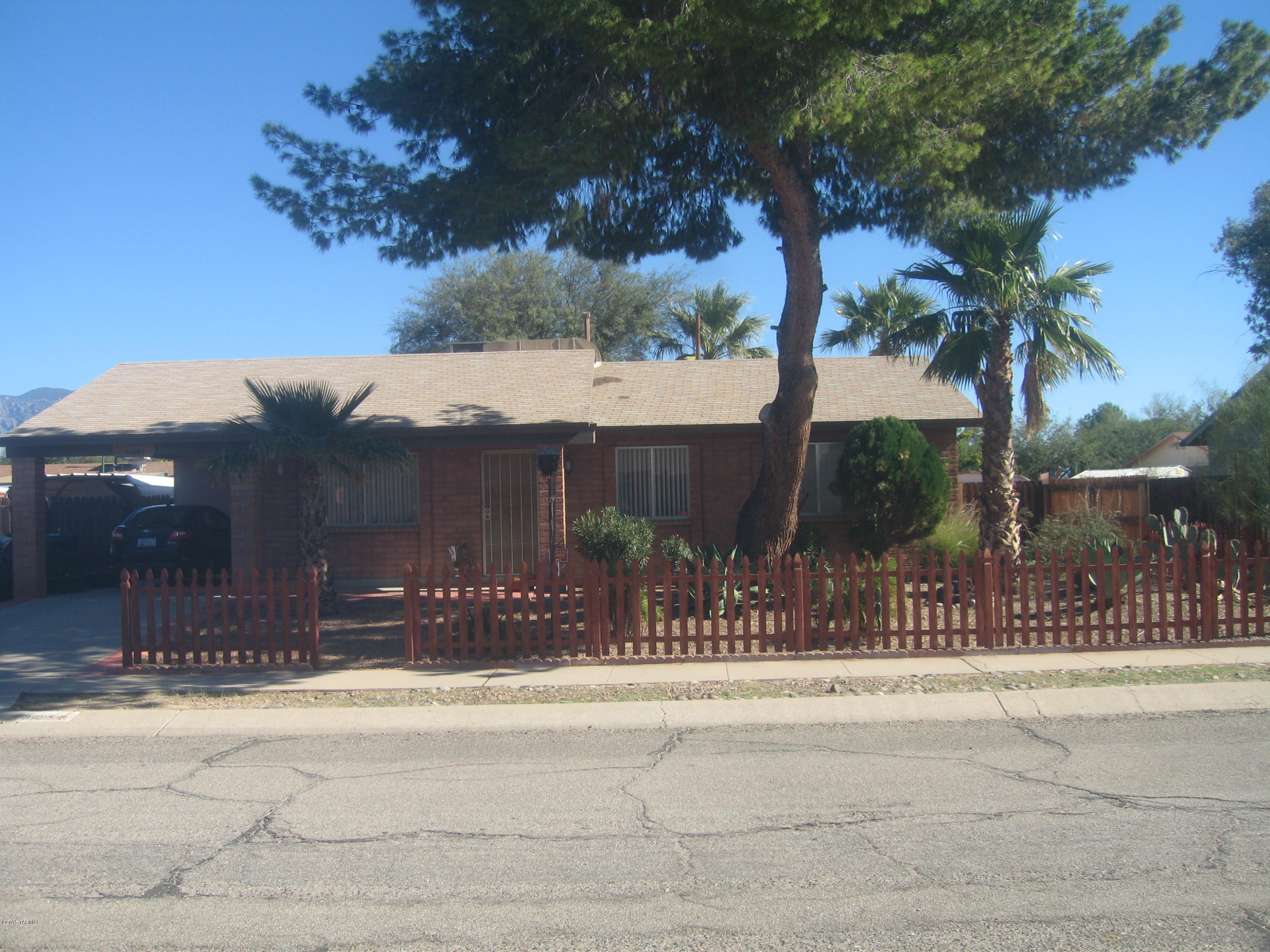 COME SEE A GREAT HOME W/SOME UPDATING - repainted living area & new laminate flooring!! Enjoy large lot, well-kept home,no HOA dues! It features a family room w/cozy fireplace & enough space to split off and make a 3rd bedroom. Relax in a lovely back yard w/mature vegetation & fruit trees, plus enjoy an outdoor entertaining area including a covered Ramada w/built-in bar-b-que, plus a 10 x 16 storage shed/workshop w/electricity & A/C. Don't miss double-wide gate to the back yard.  There's also a community park near-by w/bar-b-ques & w/playground equipment! Property has been well-maintained, & awaits a new owner!  CALL NOW!!  - DON''T MISS OUT!!