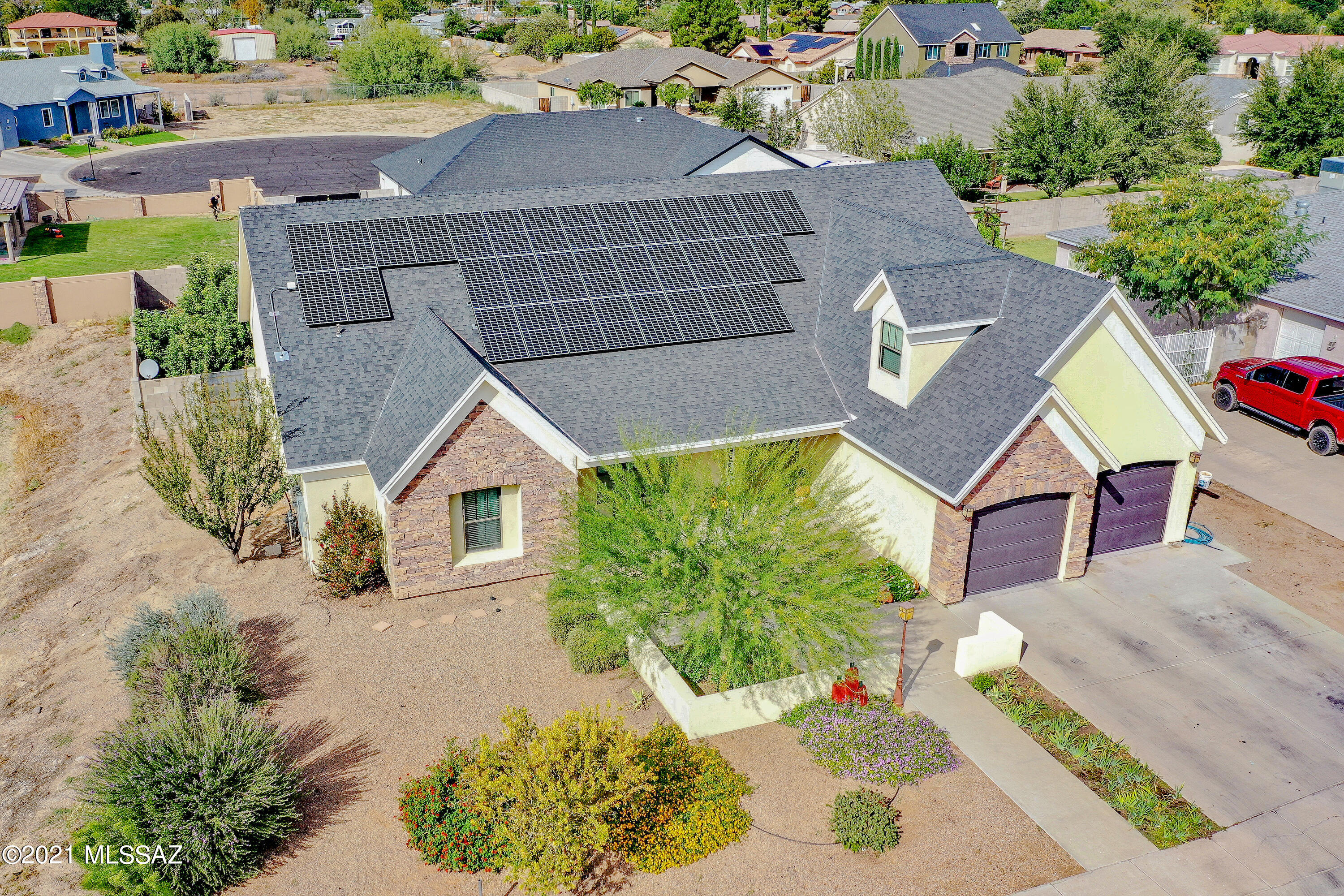 Have you been waiting for a home with just the right amount of space for everything? With Solar panels that will cover your electric bill most of the year? A backyard for entertaining (did someone say wood fired pizza?) Office where you can truly work from home in a designated space? A craft room? Open Concept?Look no Further! This custom home has an office space with a separate entry so you can meet with clients while keeping the rest of your home private. If you are a crafter, you will fall in love with the spacious utility room, with built in countertops and cabinets. The kitchen has storage galore, granite countertops, and features a pot filler over the cook top, so you don't have to heft your stock pots back and forth to the sink.The principal bedroom is on the main floor, and features a large bathroom with a deep soaking tub, walk in shower, two walk in closets and a separate water closet. Just off the main family room, is a guest bedroom and full bathroom. Head upstairs to find a large game room or movie room, 3 more spacious bedrooms, and another full bath! Showing 3913 on county records, but patio was enclosed and it is actually 4153 SF!