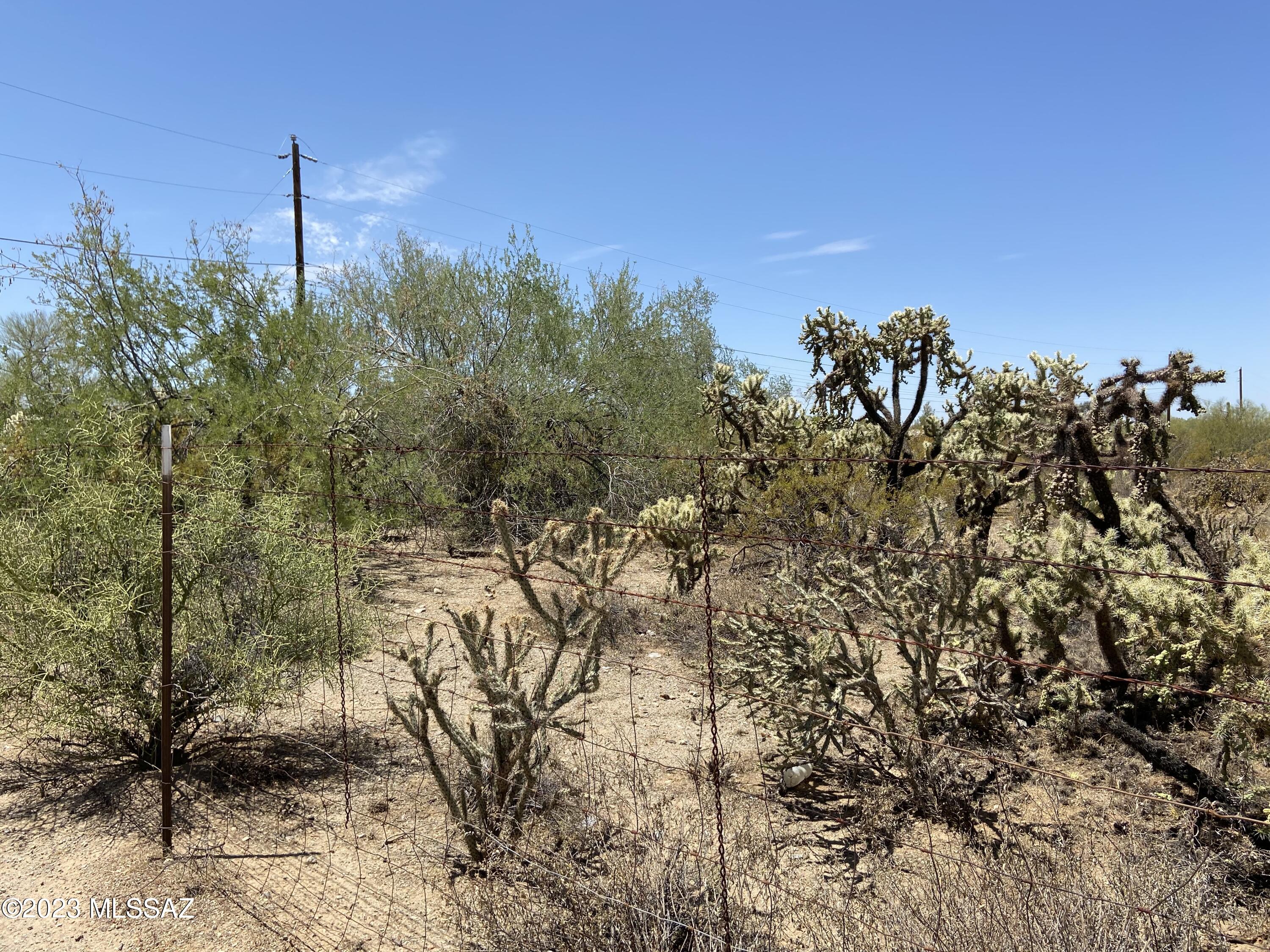 Nice secluded 2.39 Acre Lot just 2 blocks off paved road in Picture Rocks. Water and electric at the street. Septic will need to be added. GR1 Zoning with many possibilities. 2 additional 2 acre adjoining lots available. Possible Owner Financing: 30k down, 8% interest, 5 year stop and no prepayment penalty.