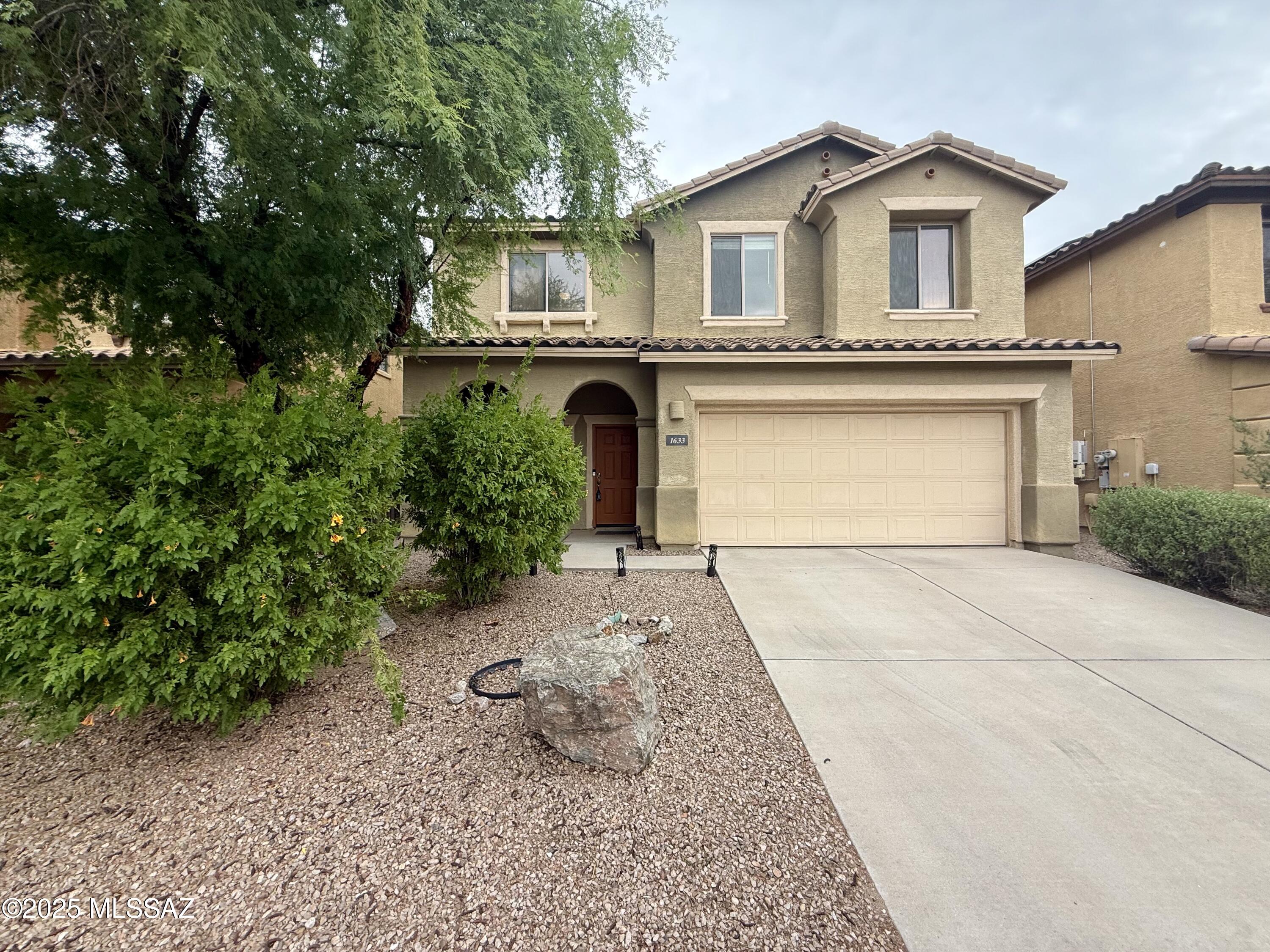 Welcome to this charming two-story home located in Tucson's sought-after Paseo Del Rio community. Offering 1,560 square feet of well-designed living space, this residence features 3 generously sized bedrooms and 3 full bathrooms, providing both comfort and functionality. The open-concept great room layout is perfect for modern living and entertaining. The kitchen is equipped with all major appliances—including a refrigerator, oven, microwave, dishwasher, washer, and dryer—and features a welcoming design that seamlessly blends into the main living areas. Enjoy neutral flooring throughout, creating a bright and cohesive aesthetic. A private 2-car garage offers added convenience and storage. Ideally situated near top-rated schools, parks, dining, and entertainment options, this home combines comfort with an unbeatable location.
