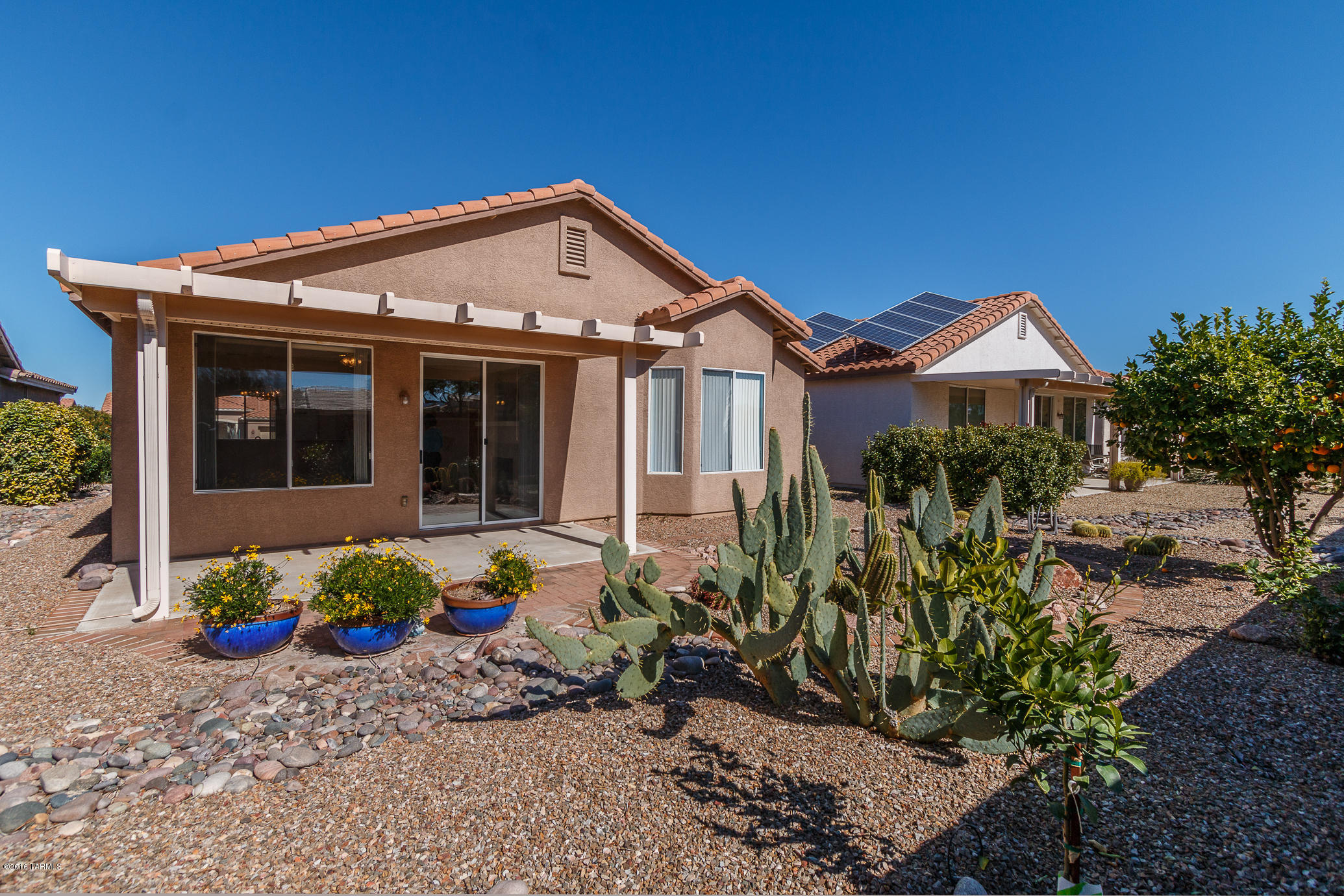 Enjoy sunsets and mountain views from your backyard! Beautiful well maintained Sierra model home. The large Great room is open to the kitchen and features hardwood floors with a formal dining area perfect for entertaining. Master suite with hardwood floors, two closets and mountain view from the bay window. Large master bath with walk in shower. Lovely low care desert landscaping in the front and backyard. Retirement at it's best!