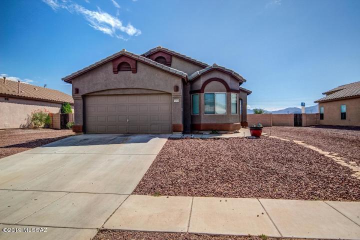 Put this home on your list to see today! This home is located on a large lot! Maintenance free landscaping will enable you to come to the table with your own plans to make this your oasis in the desert! Vaulted ceilings, good sized bedrooms, and beautiful tile are only a few of the features you will love in this home! Arched doorways and neutral colors are always a plus! Dine in kitchen opening to the living room creates that perfect entertaining atmosphere! Indoor laundry and large master bedroom! This home is priced to sell! See it today!