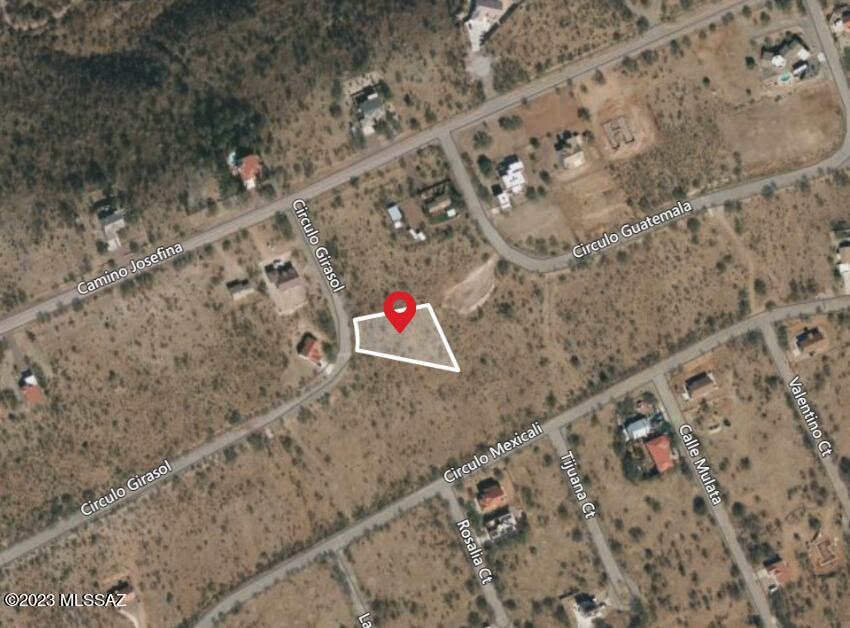 Flat lot with great mountain views! Easy access to property with paved roads and about 10 minutes from 1-19. Great buildable site with city water, city sewer, and electricity to property line. Agent/Owner