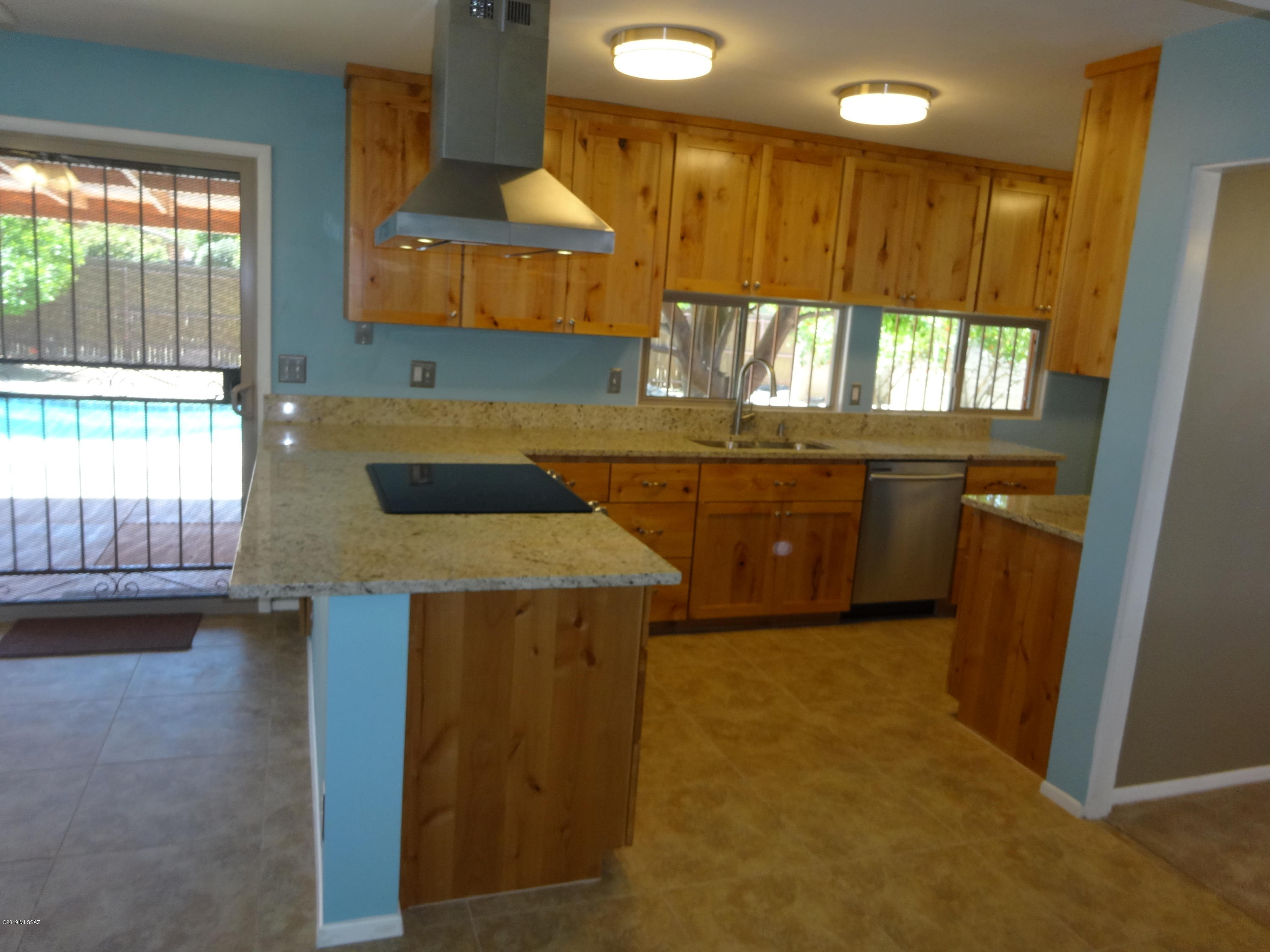 Wonderful 3 bedroom, 2 bath remodeled home in quiet cul-de-sac. Roof, AC and windows were updated about 2 years ago.  The Kitchen has new cabinets, new granite counter tops, new oven hood, stove and dishwasher.  The bathrooms have been updated with granite counters, new shower and toilet.  All interior lights, fans, tile, carpet, paint are new.  Pool was newly plastered and tiled about 3 months ago.  This is a gardeners dream. Many areas to plant your garden.  It has 3 fruit trees and two pomegranate bushes.  It has two large water tanks to recycle rain water.  It has a large shed and a chicken coop.  Walking distance to update Jesse Owens city park on Sarnoff.  Close to shopping.  Lighted street lights in Cul-de-sac. Wonderful 3 bedroom, 2 bath remodeled home in quiet cul-de-sac. Roof, AC and windows were updated about 2 years ago.  The Kitchen has new cabinets, new granite counter tops, new oven hood, stove and dishwasher.  The bathrooms have been updated with granite counters, new shower and toilet.  All interior lights, fans, tile, carpet, paint are new.  Pool was newly plastered and tiled about 3 months ago.  This is a gardeners dream. Many areas to plant your garden.  It has 3 fruit trees and two pomegranate bushes.  It has two large water tanks to recycle rain water.  It has a large shed and a chicken coop.  Walking distance to update city park on Sarnoff.  Close to shopping.  Lighted street lights.  This will go fast.