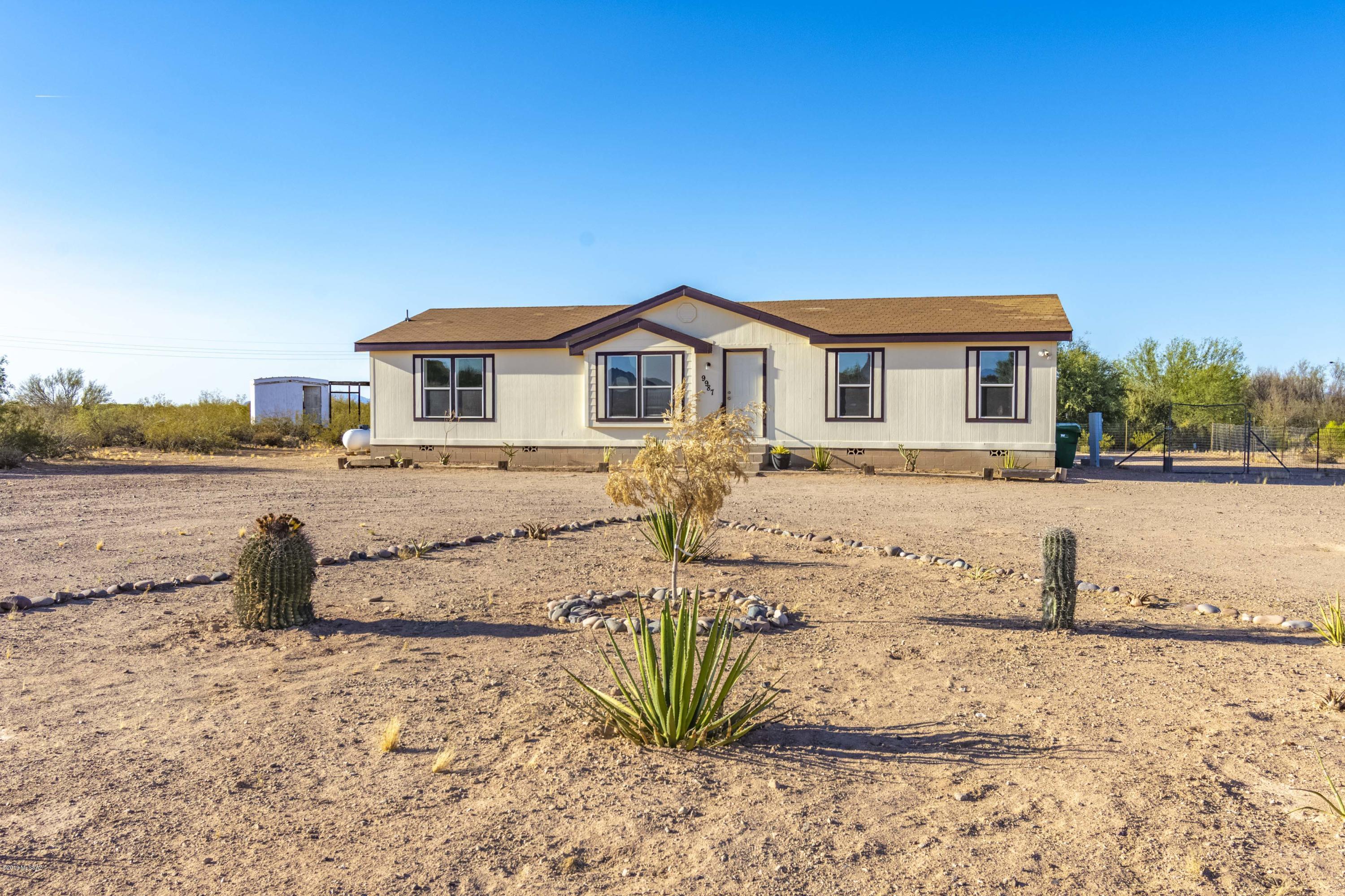 This is a beautiful manufactured home on 4.13 acres of horse property. Privacy is a plus with this home. New paint inside and out, New carpet and bathroom light fixtures. Skylights let natural light show off the open layout of this home. A garden tub to relax after a long day, and a giant master bedroom for plenty of comforts. Lot is flat and usable. Bring all of the toys for country living and your sense of peace. Find a home where you are able to relax and have mountain views all around you.
