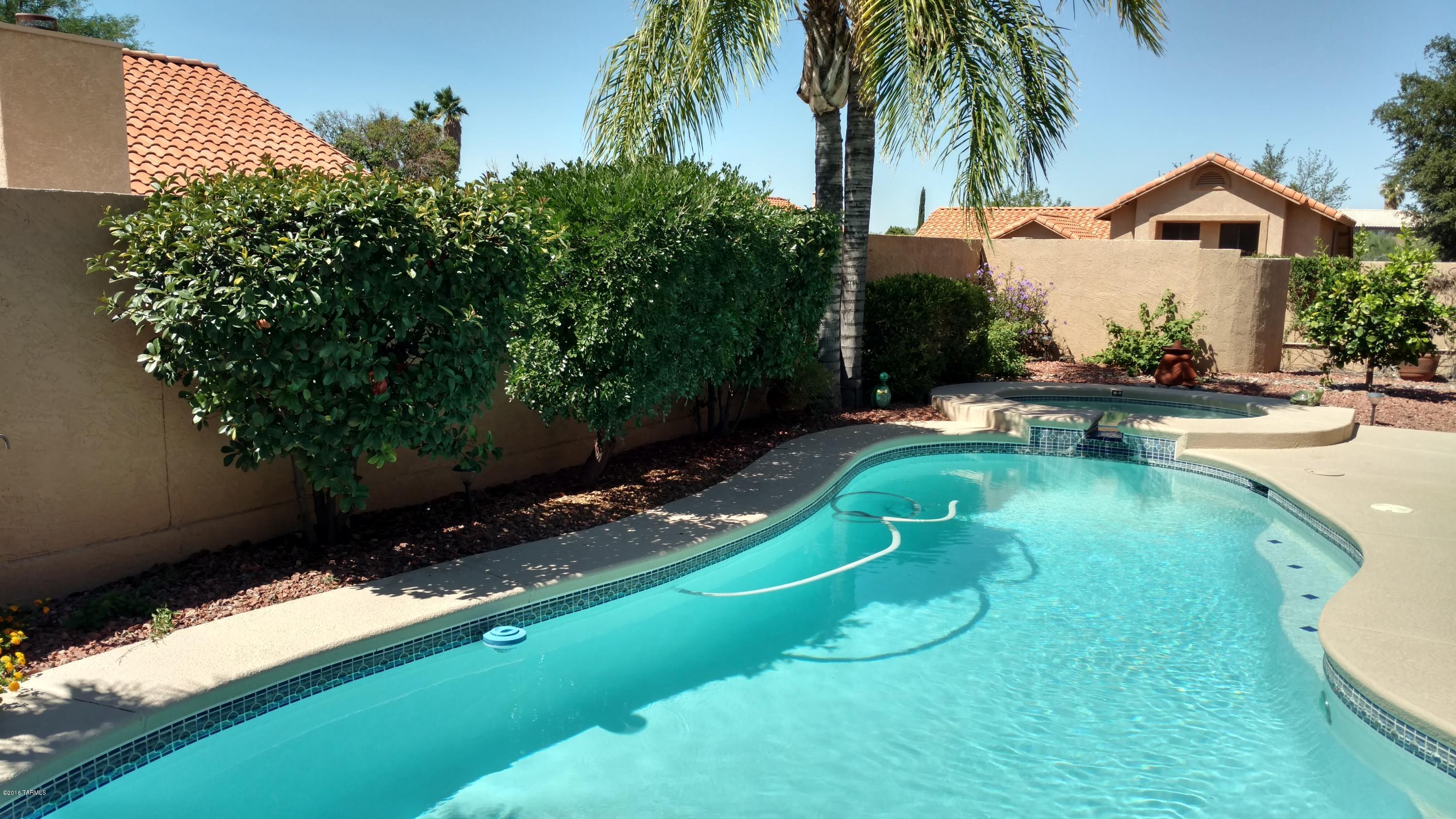 Make this spacious 2966 sqft family home in popular Copper Creek neighborhood in Oro Valley your new home. With a large master suite with his & hers walk in closets, this 4 bedroom with additional upstairs loft, 3 bath, 3 car garage home boasts a refreshing pool. Spacious kitchen with an adjoining breakfast nook and family room with a fireplace. On a corner lot, this will go fast. Heating on Spa not active. No pets. Call for easy showing.