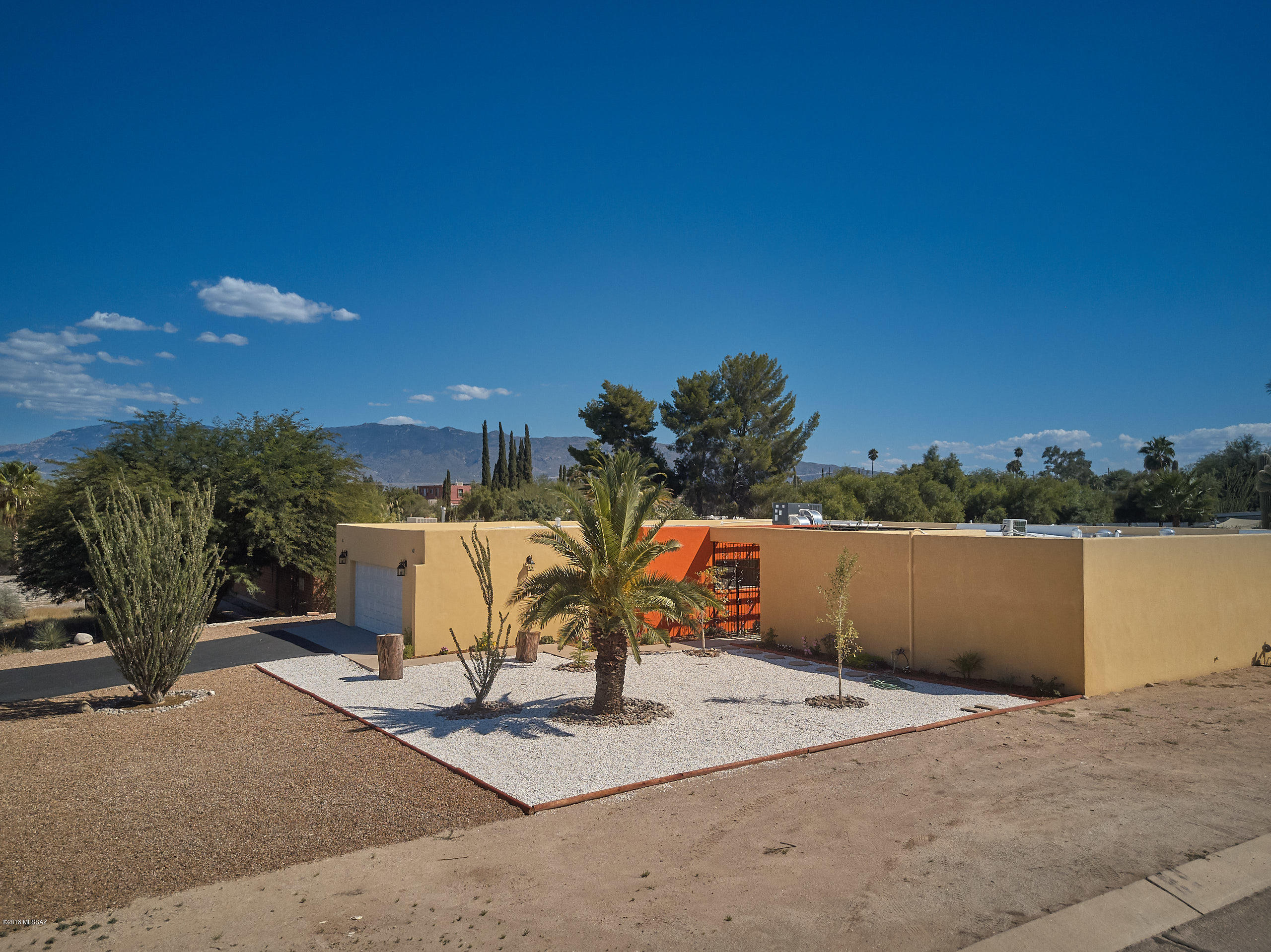 Welcome to this stunning turn key home in beautiful NE Tucson. This 4 bed 3 bath home is situated on a large lot in a desirable location close to many conveniences. The home has been fully remodeled with stylish designer touches including a new kitchen with granite counter tops and SS appliances, bathrooms with tiled shower enclosures, tile and wood floor, new HVAC , and new dual pane windows. The home features an open floor plan with wood beamed ceilings and lots of light. Fantastic curb appeal from the moment you pull up with fresh designer paint, 2 car garage, courtyard entry with a pergola and a solid wood front door. The backyard is perfect for entertaining with a large pool and attractive landscaping.