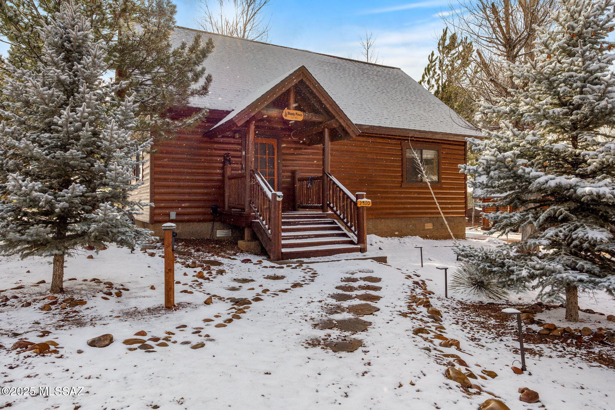 3-Bed, 2-Bath Cabin in Gated Community - Move-In Ready Nestled in the serene and picturesque Overgaard, this charming cabin offers a peaceful retreat in a private, gated community. This open concept layout, includes a spacious loft, currently used as a living room but easily convertible into a third bedroom. Interior features include wood trim, peeled pine accents, aspen cathedral ceilings, and a stone fireplace. The kitchen features granite countertops, and the living area has wood flooring. The cabin comes fully furnished with new appliances, dishes, linens, and more, making it move-in ready. Outdoor amenities include covered front and back porches, a built-in propane grill, and a new in-ground grill and smoker. The two-car driveway includes a 50 Amp for for a possible EV charging station. HOA amenities include access to the Community Lodge overlooking a large pond, available for family gatherings and events. The community offers lush trees, ponds, and maintenance-free grounds and a lodge that can be used for family gatherings and events.