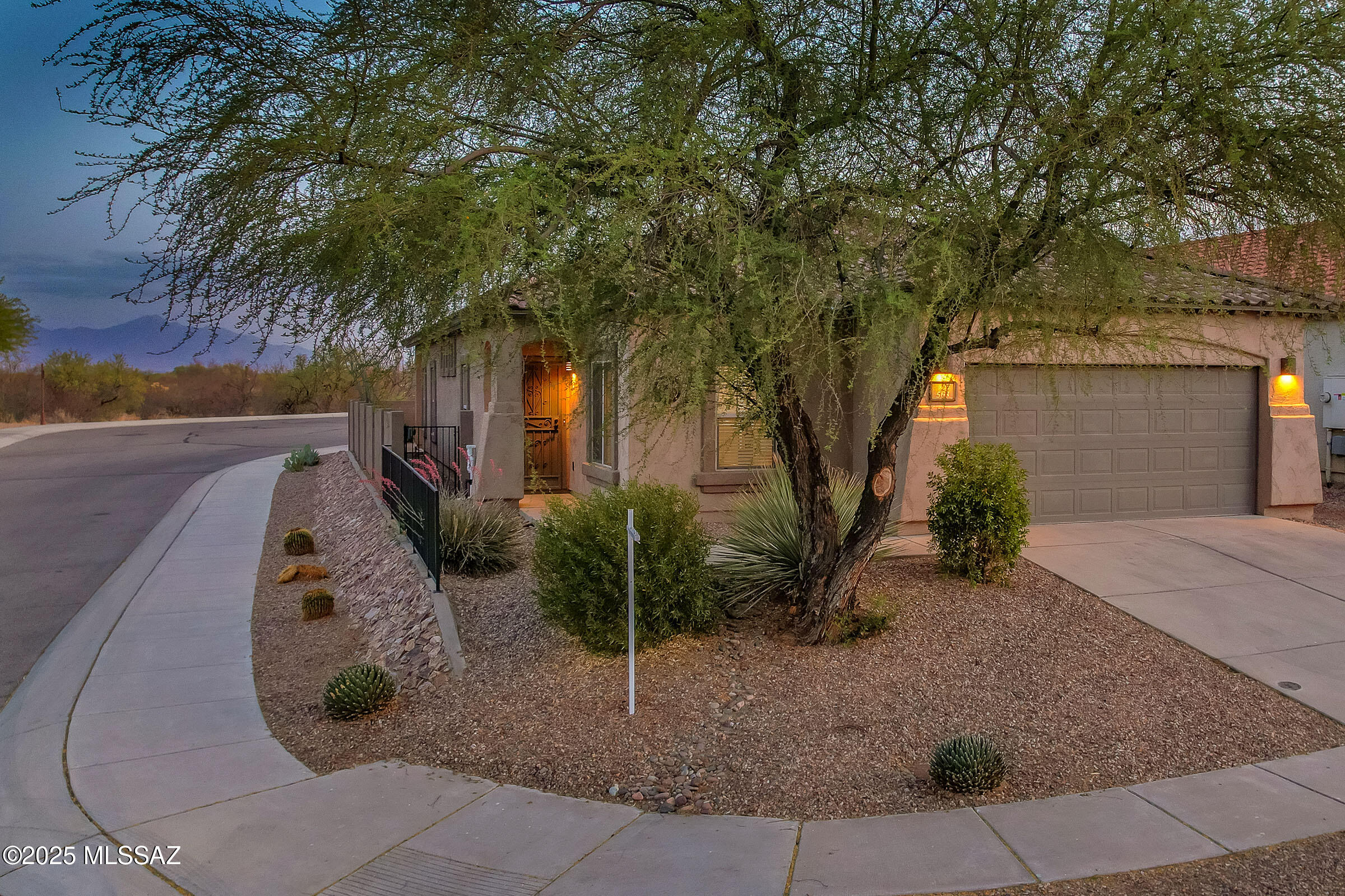 Low Interest Rate! Seller is offering 2% of the Purchase Price to buy down the interest rate by 2%! See flyer in attached documents! Solar & TEP bill less than $60 per month! Charming Move-In Ready Home in Rancho Sahuarita! Equipped with energy saving leased solar system and $10,000 in upgrades! Welcome to this beautiful 3-bedroom, 2-bathroom home located in the highly desirable Rancho Sahuarita community! This home offers an open floor plan with abundant natural light, perfect for comfortable living & entertaining. The modern kitchen features updated quartz countertops, single stainless steel sink & ample cabinet space, with all appliances included. The primary suite includes a private ensuite bath with walk-in shower &  walk-in closet. New luxury plank vinyl flooring in all 3 bedrooms! Two additional bedrooms provide plenty of space for family, guests, workout room or home office. End lot backs to cul-de-sac with Mountain VIEWS and low-maintenance landscaping in both the front & backyard! Plus access to top-tier community amenities, including pools, parks, fitness center, walking trails, and more! Call today for your private showing!