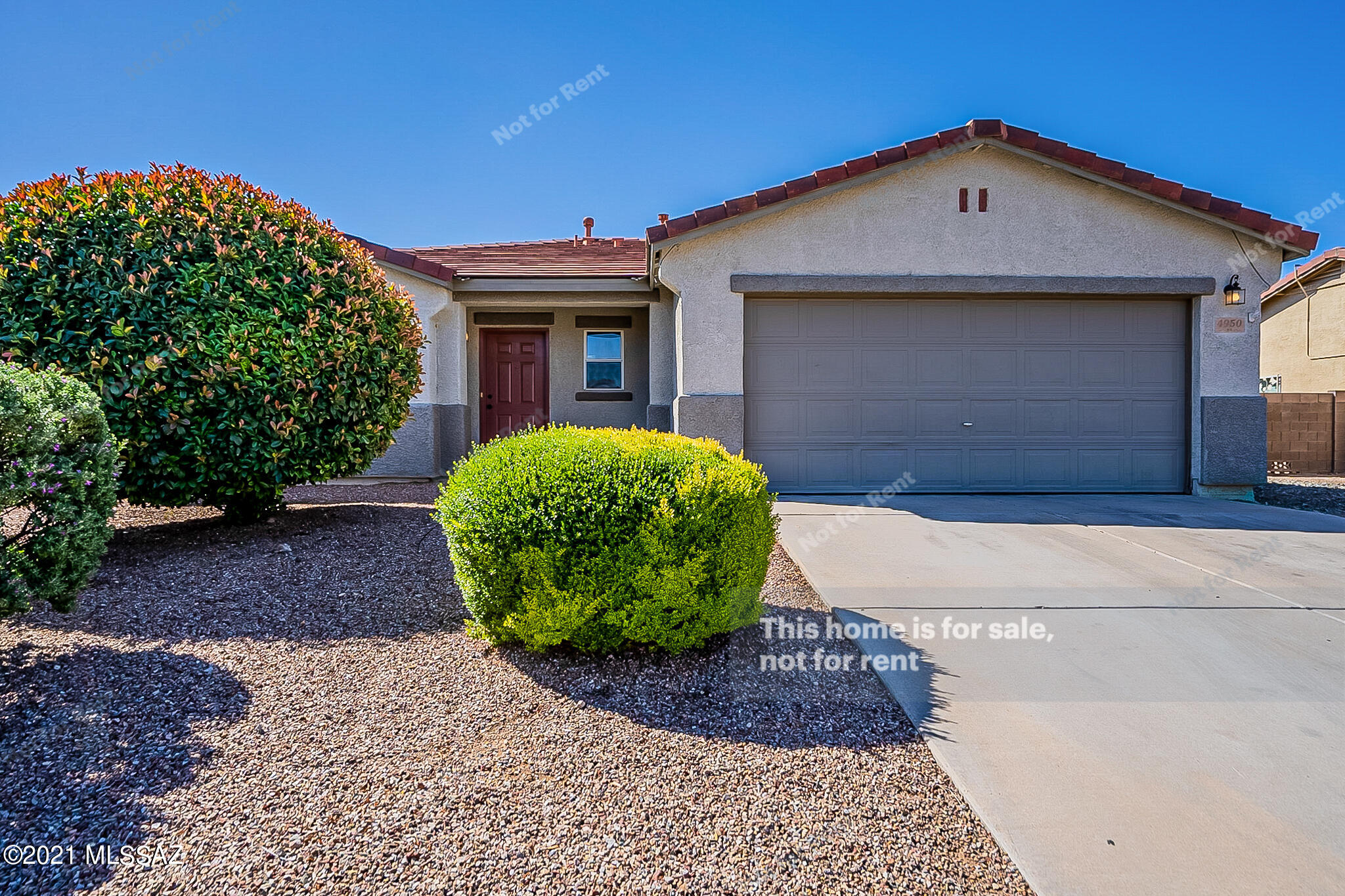 This Tucson one-story home offers an in-ground pool, a patio, granite countertops, and a two-car garage.