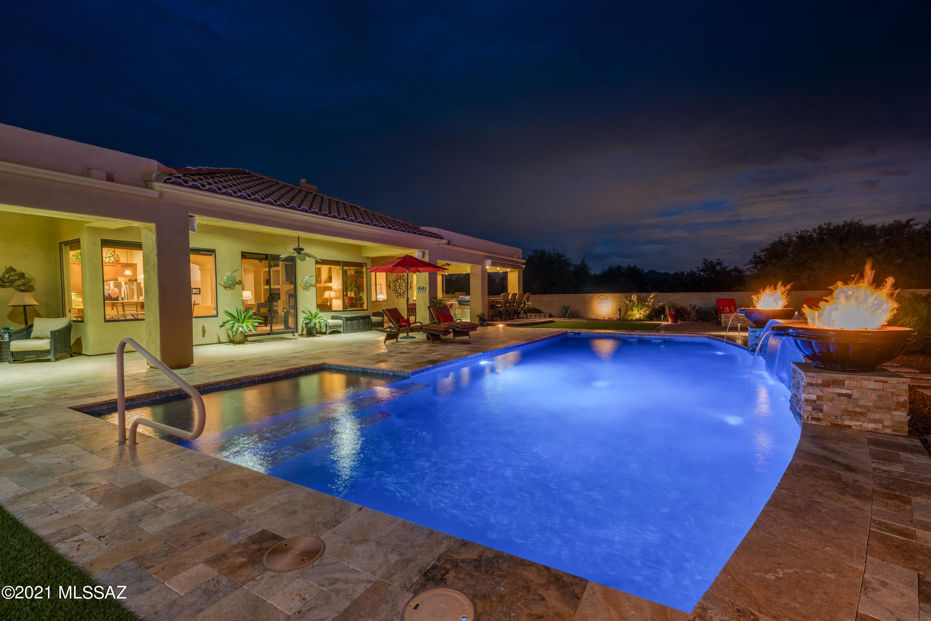 Beautiful, over 3,000 sq. ft. Pepper Viner home on well over 1 acre lot in a lovely, gated community. This immaculate, exceptionally well-maintained newer home will amaze you! There are upgrades and updates everywhere you go so get yourself ready for the touches of luxury! Large kitchen boasts granite countertops, top-of-the-line stainless steel appliances, state-of-the-art solid wood cabinets and an island with bar. High ceilings with fans, large double pane windows and lots of natural light will make you feel comfortable. Two gas fireplaces, in the family room and master bedroom, are perfect for the cooler nights to come. All bathrooms have executive height cabinets, bathtubs and showers. Perfect open / split bedroom floor plan. Huge master suite will please the most discriminating homeowners. Guest quarter has a private bathroom and adjacent living room (bonus room) for your guests' comfort and your privacy. Newer (2019) HVAC will keep you comfortable year-round. The entire house was repainted in 2019 and has a water softener. Huge resort-style, fully walled and private backyard will blow you away! It has it all: enormous covered patio, amazing outdoor kitchen with granite counters, 40' x 20' heated salt water pool, gas firepits, gazebo, beautiful low maintenance landscaping, mountain and sunset views. Leased solar system with excellent terms covers about 100% of the household electricity needs. The property is far from busy streets yet close to the city. Welcome to paradise!