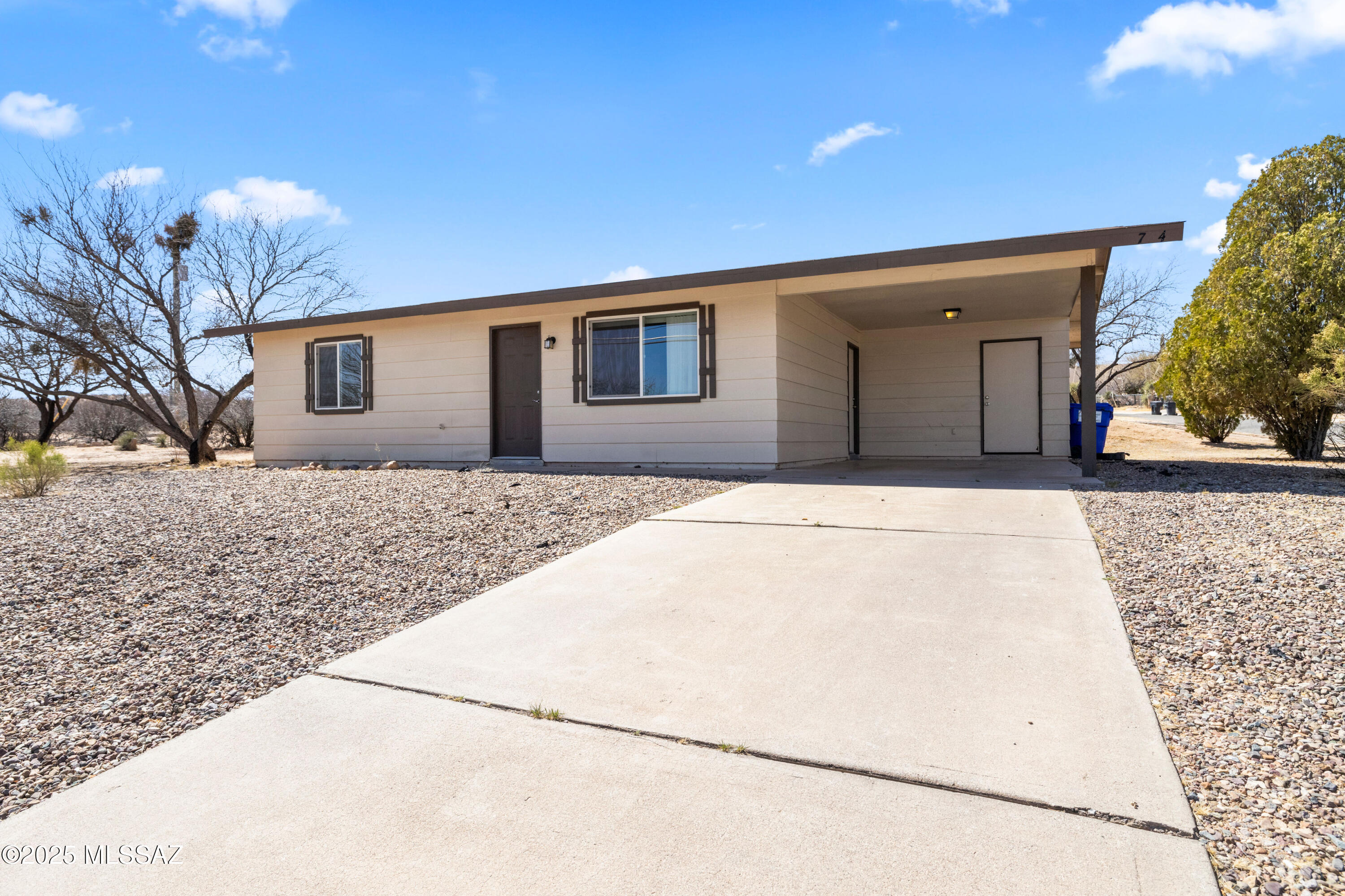 This updated 2-bed, 1-bath home offers 1,084 sq ft of comfortable living space. Located on a large corner lot, the home features a bright living area, functional kitchen, and spacious bedrooms. Enjoy a private, fenced backyard perfect for outdoor activities, and a covered carport for parking. Central air conditioning ensures year-round comfort. Close to schools, parks, and downtown Benson, this home provides both convenience and charm. Schedule a tour today and make this your new home!