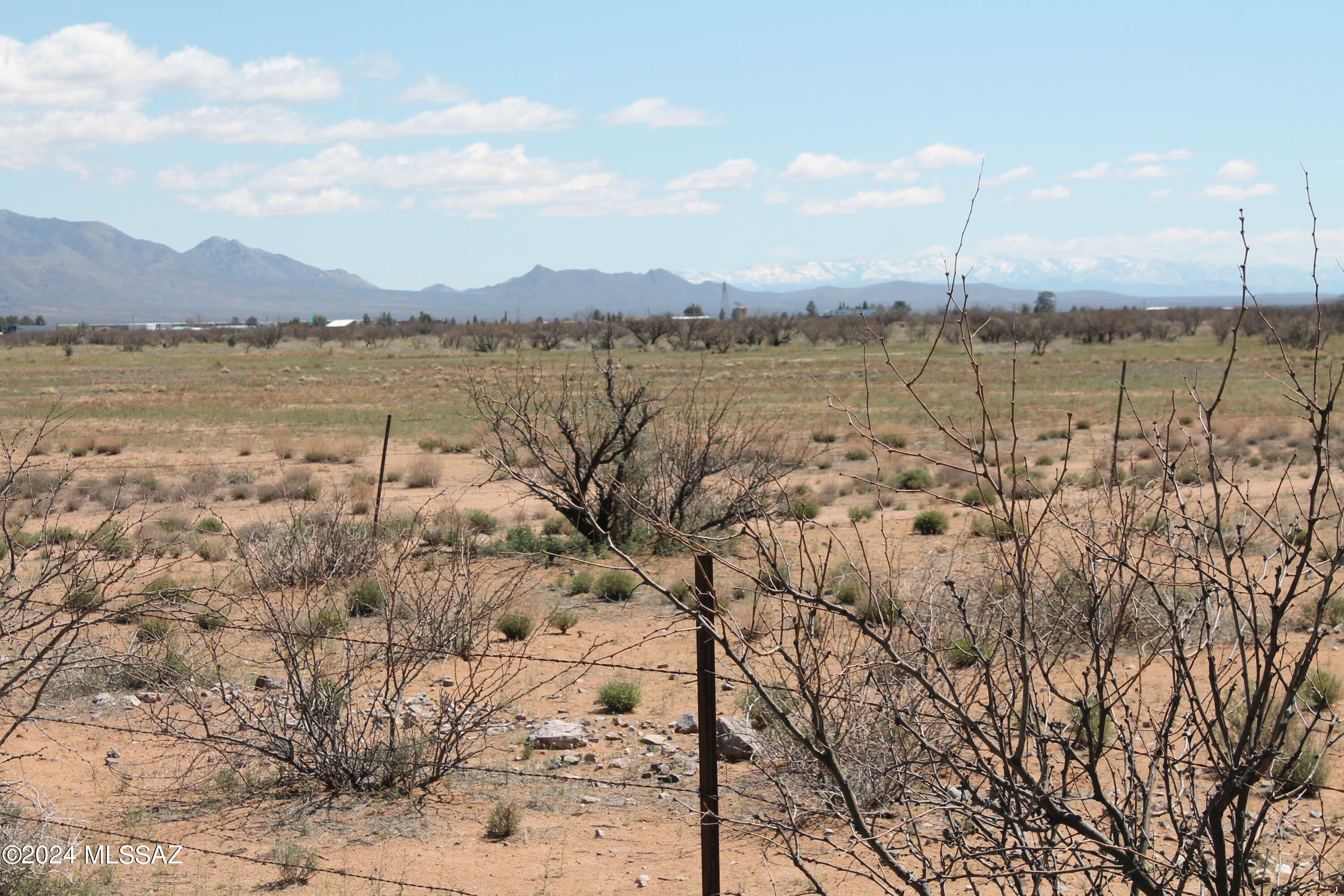 If you want country living but want the luxury of being close to town, this is the property for you. Its about 3 miles from I-10 and just a short distance to Wilcox. It is 36.11 acres of flat land, there is a wash to the west of the property but plenty of room to build your custom home. Completely fenced in property with mountain views. The road into the property is graveled rock.