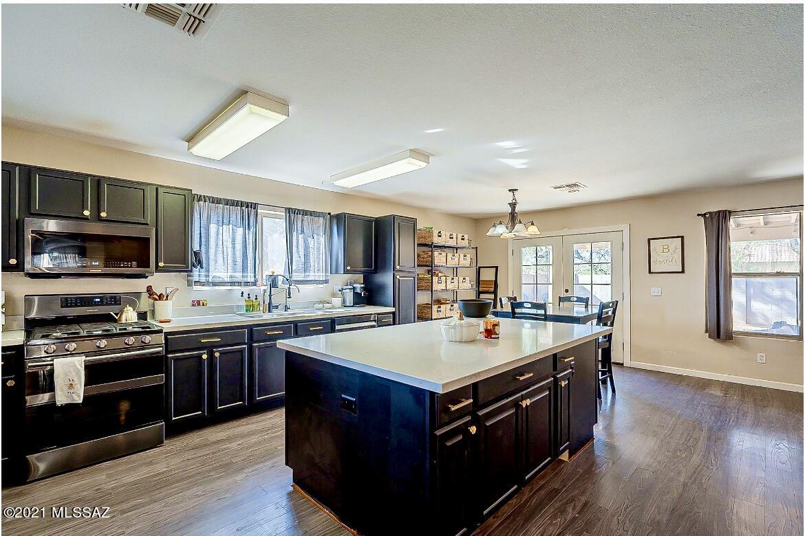 Charming Mid-Century Modern vibe in this beautifully upgraded home! Engineered wood flooring, HUGE, gorgeous black and quartz center island, quartz counter tops, tons of storage, black undermount sink, industrial black spray faucet!   Huge walk in closet in master, Large laundry room, Very large corner lot, huge covered patio for entertaining! Award-winning schools, close to I-10 for easy access, but no road noise, close to shopping, Luxury outlet mall, etc. 

*Agents, please see agent remarks