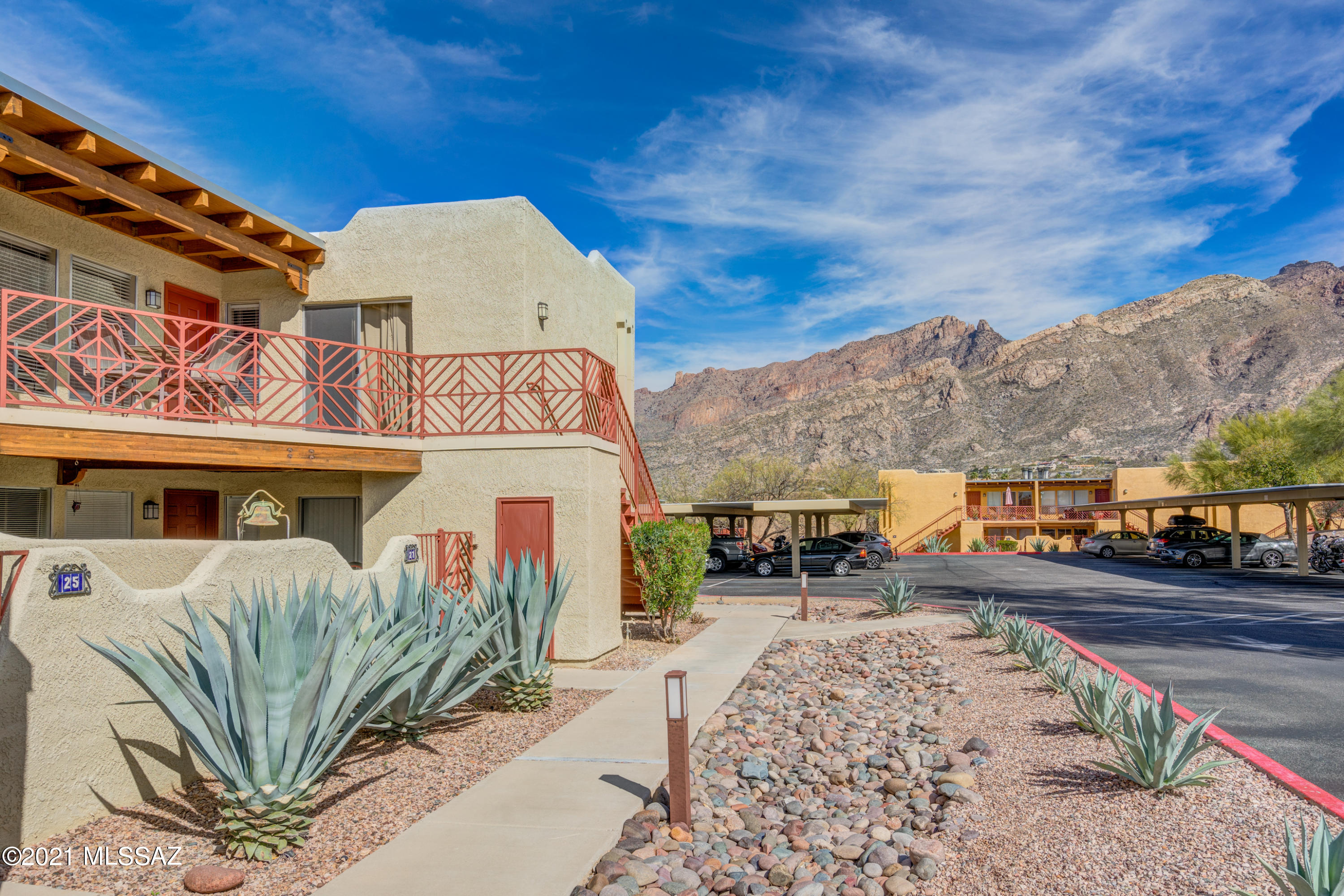 2nd Story Condo in Resort like Community of Reflections in the Catalinas. Large living area with open concept for kitchen, dining and living room. Bright and welcoming. Newer HVAC, New Carpet in living area and bedrooms. Enjoy your coffee on the front patio while gazing at the Catalina's. HOA includes water/sewer, trash, roof, streets, grounds, building maintenance, spa, pool, and exercise room. Dedicated covered parking.