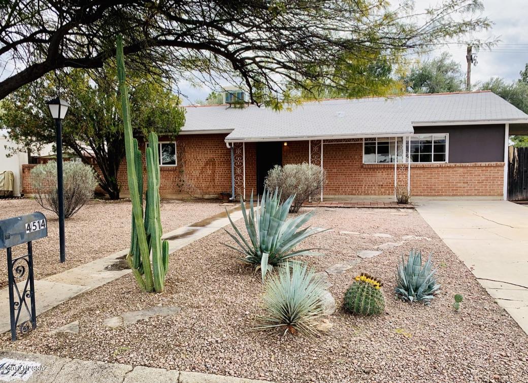 Super delightful ranch style brick home.  Saltillo tile floors, super sweet kitchen with vintage charm, and private back yard. Located on a quiet dead end street. This home is larger than most in the neighborhood. Large laundry/workshop/storage room has bonus walk in shower.