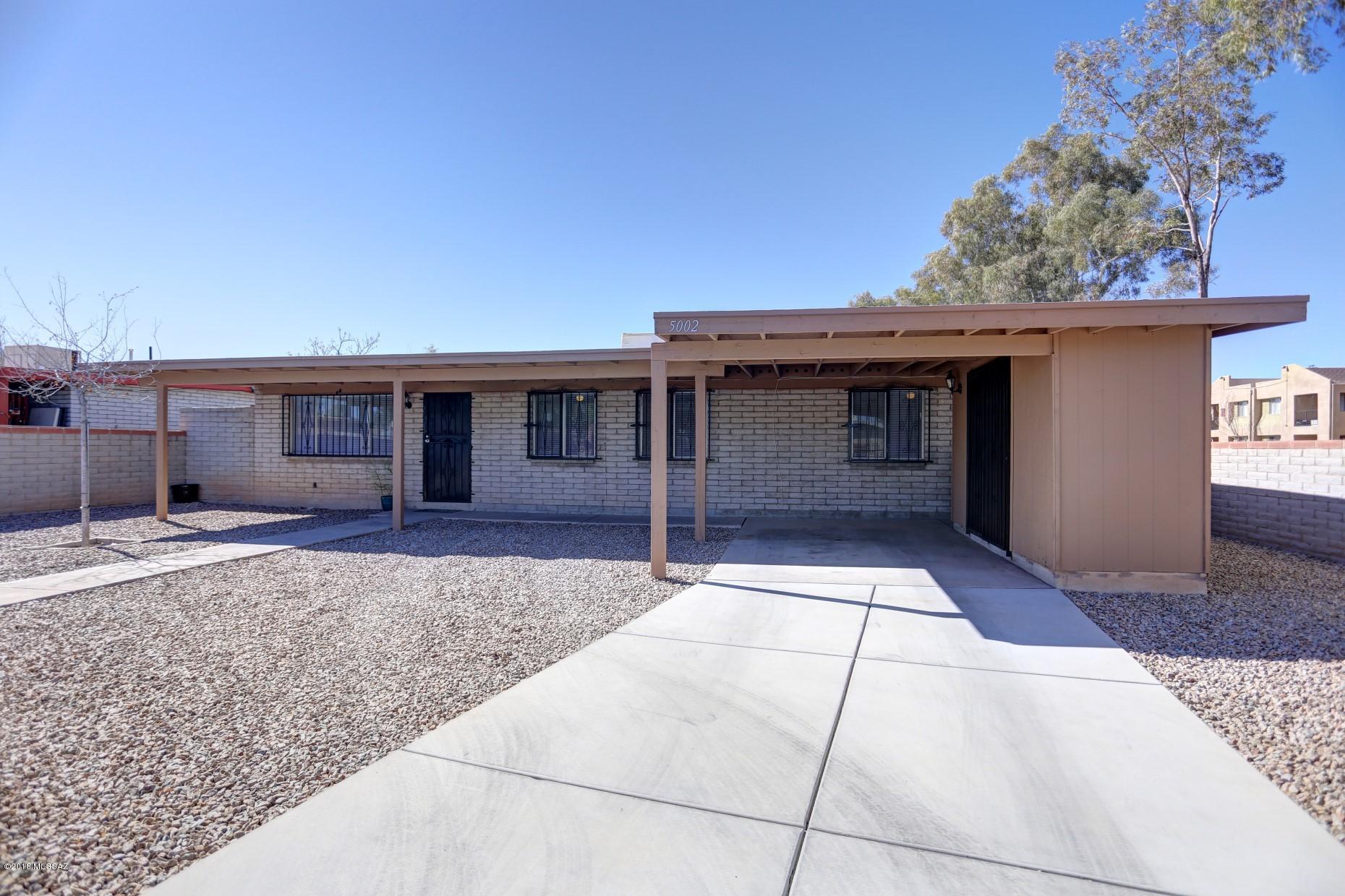 Four bedrooms!  Two full baths!  Lovely back yard!  Newly painted, new cabinets in kitchen, new tile in bathrooms, clean and move in ready!  Close to bus line and shopping! Open floor plan, spacious kitchen has plenty of countertops for the gourmet chef in the house, and covered back patio is a natural for entertaining.
If you have pets, the block fence will prevent him/her from wandering the neighborhood.  
Both showers have been refurbished with large tile and decorative inserts, similar to what is seen in new homes.  
If your client is looking for value in an affordable price range, look no further.  This home wins hands down!