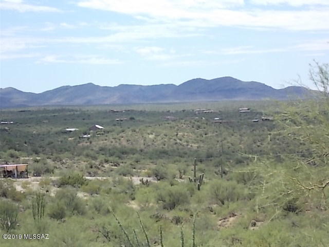 Panoramic views of the area with the Saguaro National Park approximately 1/4 mile to the north and 1/2 mile to the east.  Rural, foothills living yet not far to city and shopping.  Water, electric and phone* at lot line.  Deed restrictions to protect your value but not overly restrict uses.   Map of lot located under documents tab.  One of 2 lots for sale with 1/4 well share.  Taxes and tax code are from a larger parcel that contains 4 lots.  Seller is licensed as a real estate broker in the State of Arizona. 

* Actual phone line installed in conduit at application per phone company.
