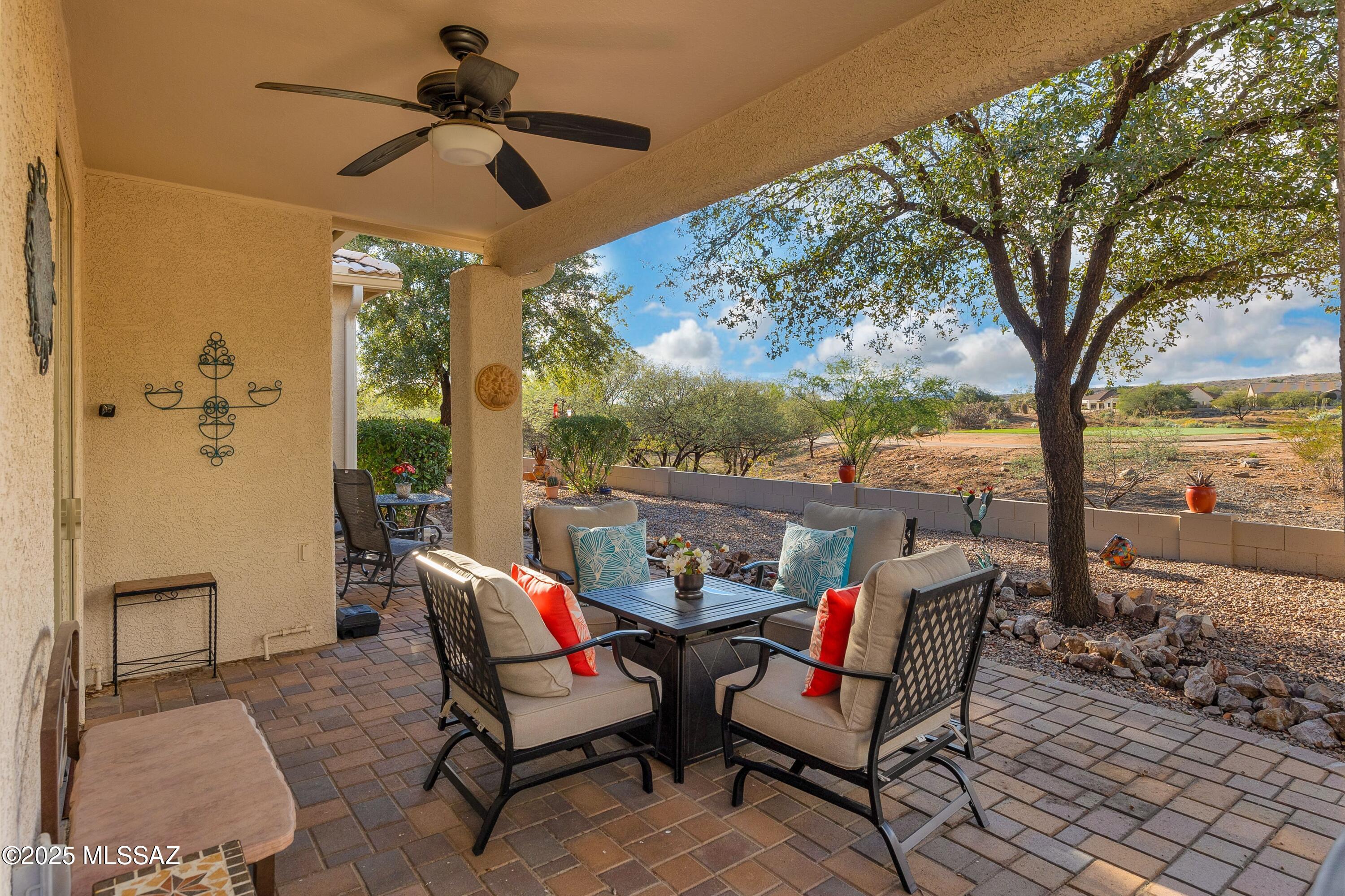 Extensively remodeled Portofino villa with open floor plan and exceptionally private patio overlooking the MountainView Golf Course. This western-inspired townhouse offers modern comfort, HOA-maintained exterior--ideal for full-time, seasonal, or investment use. A full renovation opened the entry and reimagined the kitchen with quartz counters, soft-close cabinetry, gas range with chimney hood, large island with microwave and warming drawer, plus coffee and wine station. Wood-look porcelain tile runs throughout, complemented by new Marvin windows, Pella slider, and custom entertainment wall with illuminated niches, gas-log fireplace, and 55'' TV. Spa-style baths feature tiled walk-in showers with custom storage; the primary suite adds barn-door privacy. The extended paver patio with BBQ, firepit seating, and dining area creates an inviting space for relaxing or entertaining while enjoying serene desert and golf course views.

The two-car garage includes epoxy flooring and utility sink, ideal for hobbies or projects. Additional upgrades include a 2020 HVAC system with integrated air purifier and humidifier, plus Culligan water treatment.

Located in SaddleBrooke, an award-winning active adult community offering golf, pickleball, pools, dining, and vibrant social clubs. The Villas HOA covers landscaping, pest control, exterior paint, and roof maintenance and replacement delivering true low-maintenance desert living.