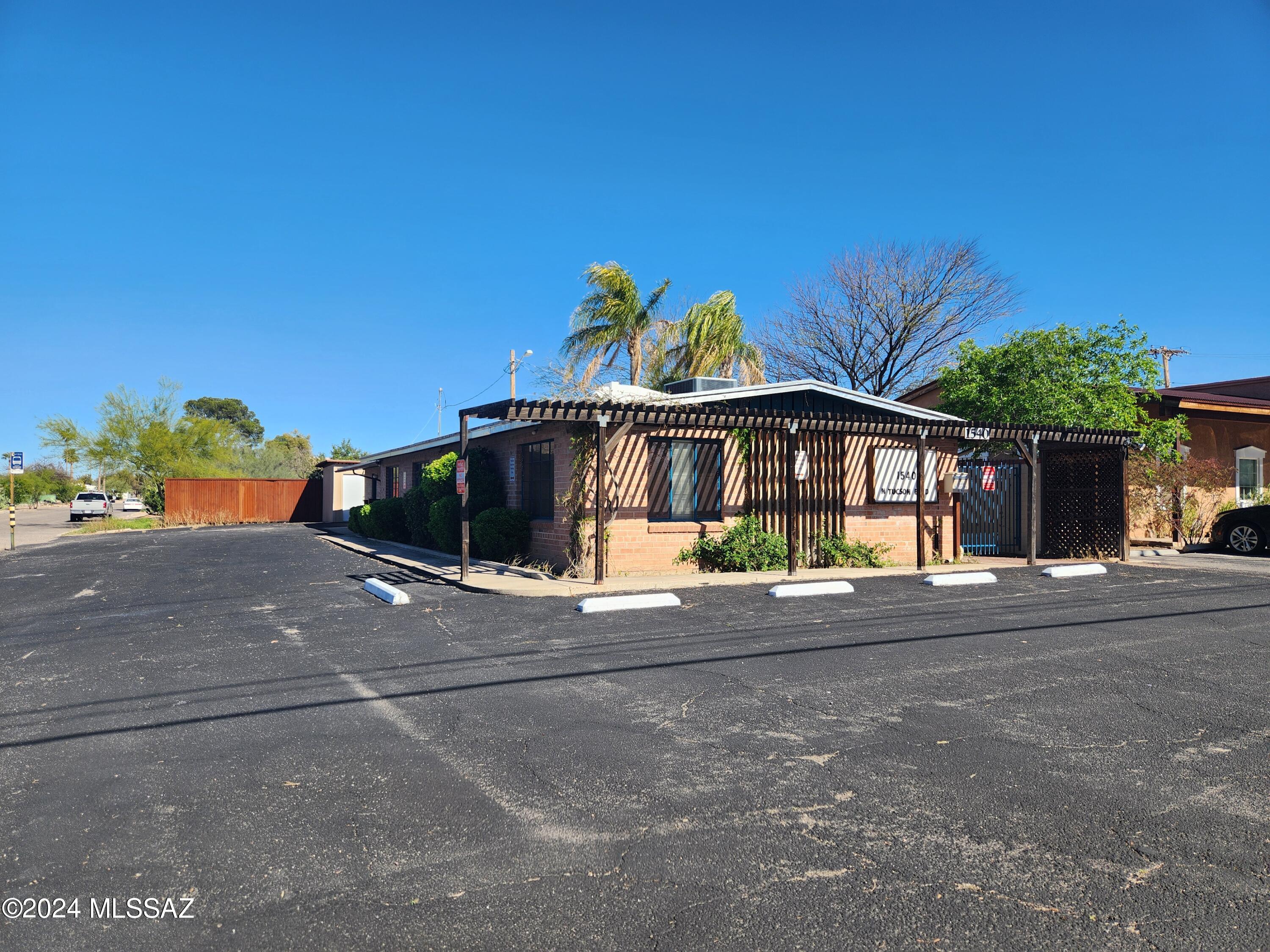 Beautiful brick building in prime location with desirable C-1 zoning which allows for residential or commercial uses. Ample parking spots, 1/2 mile from UMC, and many started upgrades. Property had been previously used as an 8 room medical out patient facility and office spaces. Current owner had began work to convert to a 4 bedroom 2 bathroom SFR with a 2 bedroom 1 bathroom guest house and a 1 bedroom 1 bathroom ADU with 5 laundry W&D hook ups, but is unable to finish. See uploaded documents tab for list of potential uses, work started and materials that will convey. Owner/Agent
