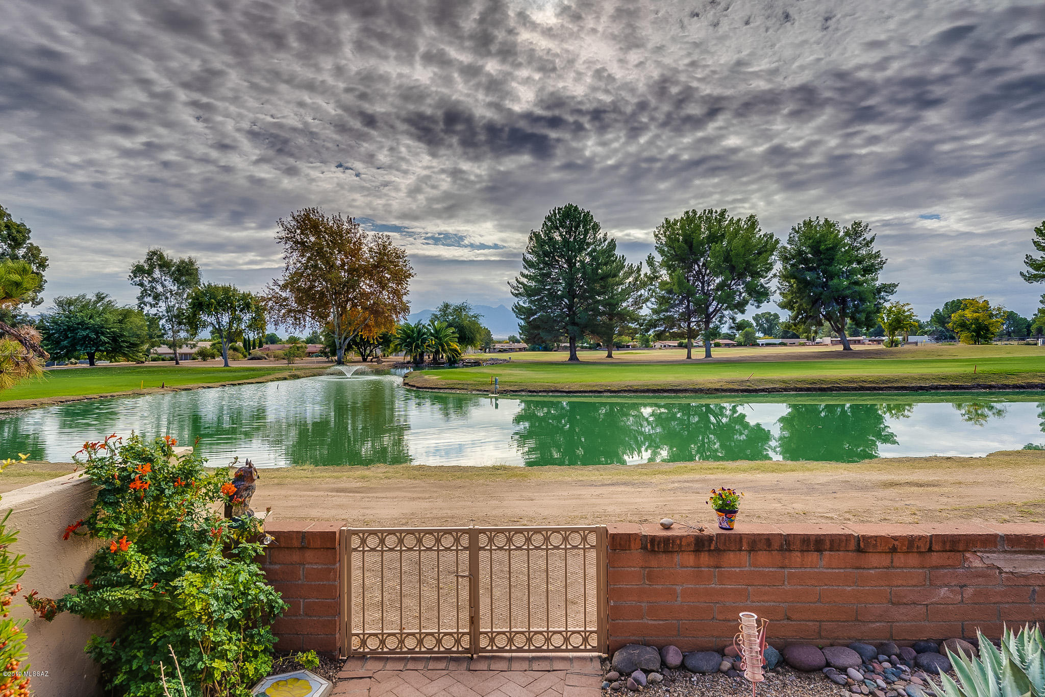 Welcome to this move-in ready home, From the welcoming front courtyard to the patio with a view of the mountains, golf course and a pond. The upgraded kitchen has high end cabinets, new stainless appliances, granite countertops and a unique tile floor. This 2 BR/2BA town-home has custom cabinets in the Master bedroom and bath, a new HVAC and so many other great features. The HOA fee covers exterior painting, exterior building insurance, roof repair & replacements and landscaping. This is a MUST SEE property that won't last long.