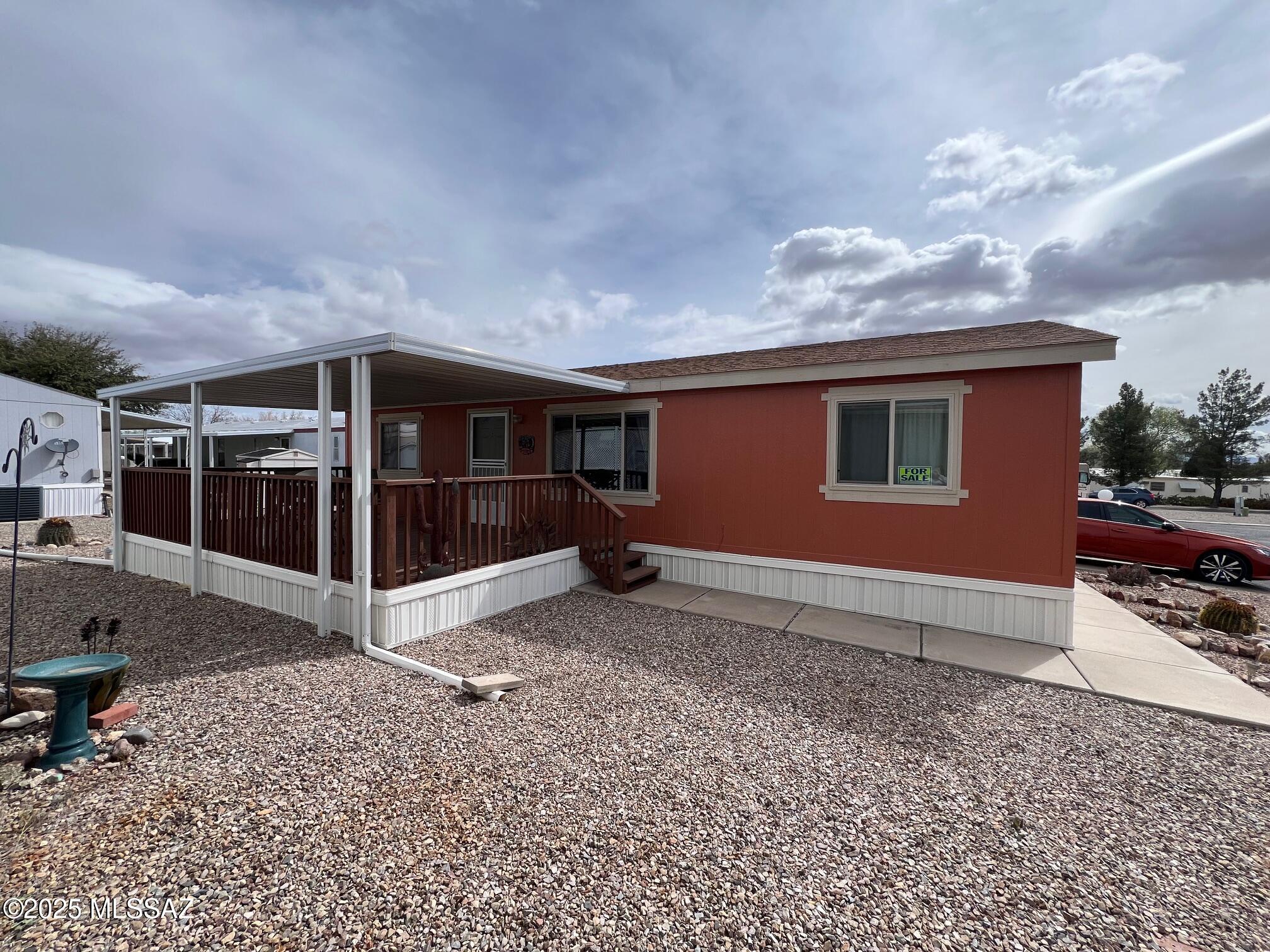 55+ Mobile home park, Well maintained doublewide, fully furnished, even the dishes plus the outdoor furniture and BBQ grill.  12 x 22 covered deck, 10 x 10 custom storage shed / workshop.  New shingles in 2017.  Park amenities include a pickle ball court, two heated pools, spa, library, craft room, two club houses, bocce ball court, and a dog park. Come enjoy the park amenities with your friends and neighbors and relax in a great retirement community. Lot rent is $498/month.   Background check required.