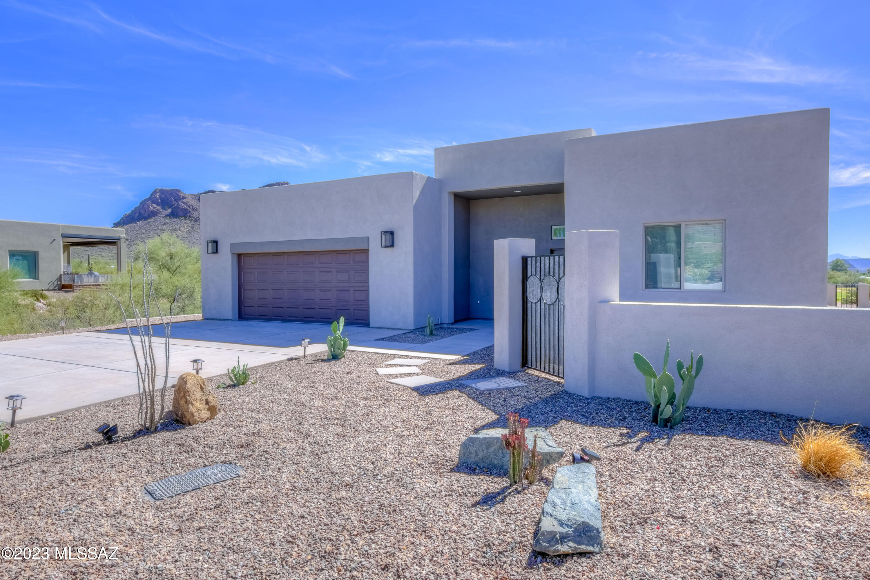 New Custom Home with Spectacular Golf & Tucson Mtn Views! Resort style living in beautiful Tucson Estates. Home features spacious Great Room w/amazing Mtn views, clerestory windows, sleek electric fireplace, custom wood-style tile floors, recessed lighting, wood blinds & much more. Custom Kitchen offers rich wood cabinets, quartz slab counters, large center island w/bar seating, gas cooking w/pot filler, stainless appliances & vent hood. Spacious Master Suite has private slider, Mtn views, walk-in closet, two separate vanities & custom tile shower. Covered back patio w/tile flooring, spacious side yard, stunning golf/Mtn views. Community Center has heated pool/spa, tennis & clubhouse. Golf privileges at Tucson Estates Golf Course & easy access to Tucson Mtn Park hiking trails! Owner/Agent