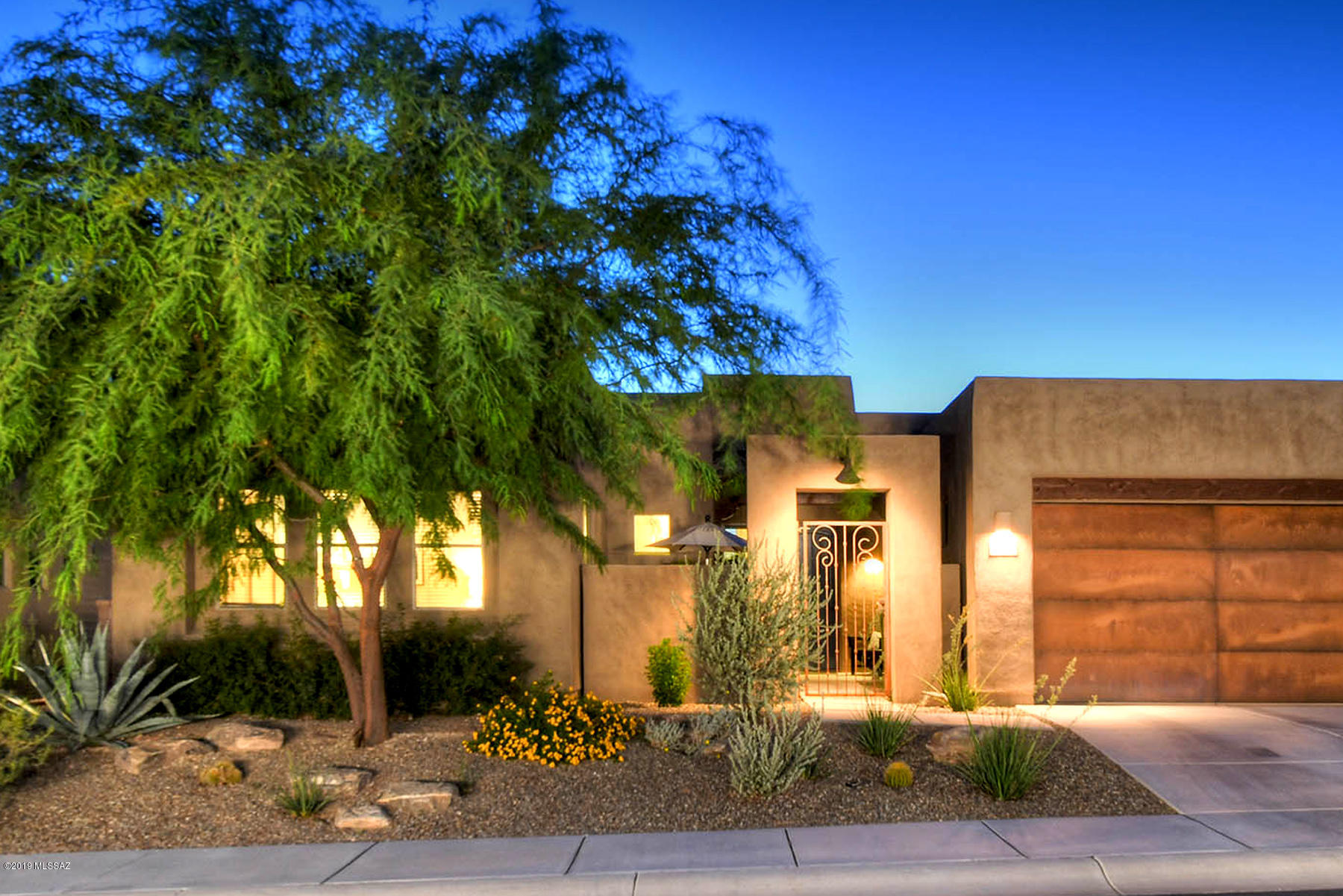 The Preserve at Dove Mountain, contemporary Insight home. TAR home tour winner. Private gated courtyard. Great room showcasing windows w/ sweeping vistas of sky, serene desert scape backyard & protected open space. Modern scored concrete floors anchor the open floor plan. View of the Tortolita Mountains from the chef's kitchen. Upgraded cabinetry in warm wood tones. Premium slab granite. GE Monogram SS appliances. Desirable split bedroom floor plan w/ master overlooking native plantings & river rock water harvesting creek. Large master bath with generous walk-in closet. Two more bedrooms, one with en-suite bath. Beautifully detailed tilework provides continuity. Bonus storage room w/ electric. Backyard bocce court and two large covered patios for year-round enjoyment and entertaining.