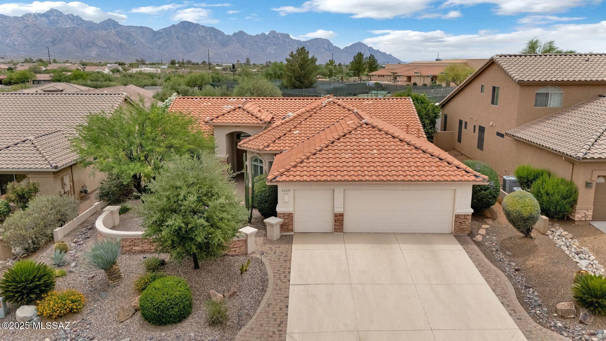 Updated & Expanded Laredo with Mountain Views. Epoxy Coated Driveway & Paver Front Courtyard. Spacious Great Room has Built-in Custom Entertainment Center with Gas Fireplace, Solar Tube & Slider to Patio. Kitchen has Granite Counters, Stainless Steel Appliances, Gas Range with Double Oven, Custom Cabinetry, Island & Dining Area. Owner's Suite has Bonus Room with Cabinetry & Slider to Patio. Owner's Bathroom has Walk-in Shower & Walk-in Closet. 2 Guest Bedrooms with Closets & Guest Bathroom nearby. Laundry Room has W/D, Cabinets & Custom Office System. Extended 2.5 Car Garage has Utility Sink, Cabinets & Epoxy Coated Floor. 2022 Roof Underlayment Replaced. Covered Flagstone Patio has Built-in BBQ, extended Patio with Pergola & Firepit. Lovely Landscaping & Fruit Trees with Mountain Views!