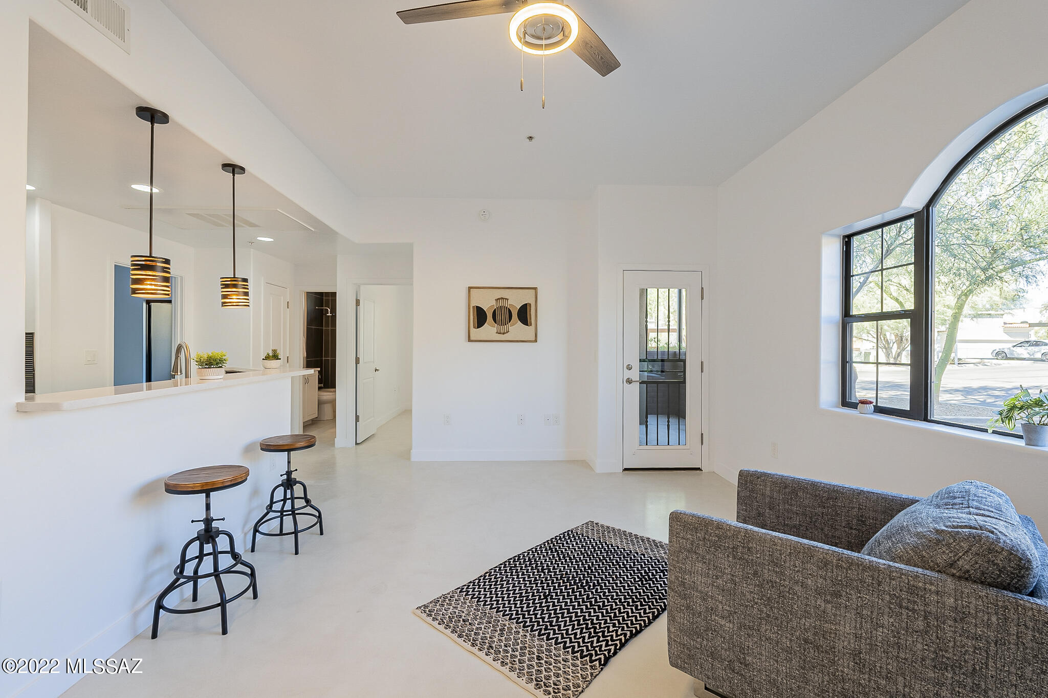 Seller will accept or counter offers between $335,000-$350,000. THIS IS IT!! Your Winter (Or All Year Round) Home Awaits!! Beautifully renovated 2 bed/2 bath condo located steps from the River walk and St. Phillips plaza. Modern kitchen features quartz countertops, sleek & modern tile backsplash and a fabulous breakfast bar. Home has Elegant concrete floors with fresh paint throughout. New stainless steel appliances are included with washer and dryer in a nice spacious laundry room. Master has an amazing large walk-in closet attached to the freshly updated bathroom with quartz topped double vanity. Outdoor areas include a patio off of the master bedroom and another spacious patio off of living area. Association allows for short and long term rentals. Owner/Agent