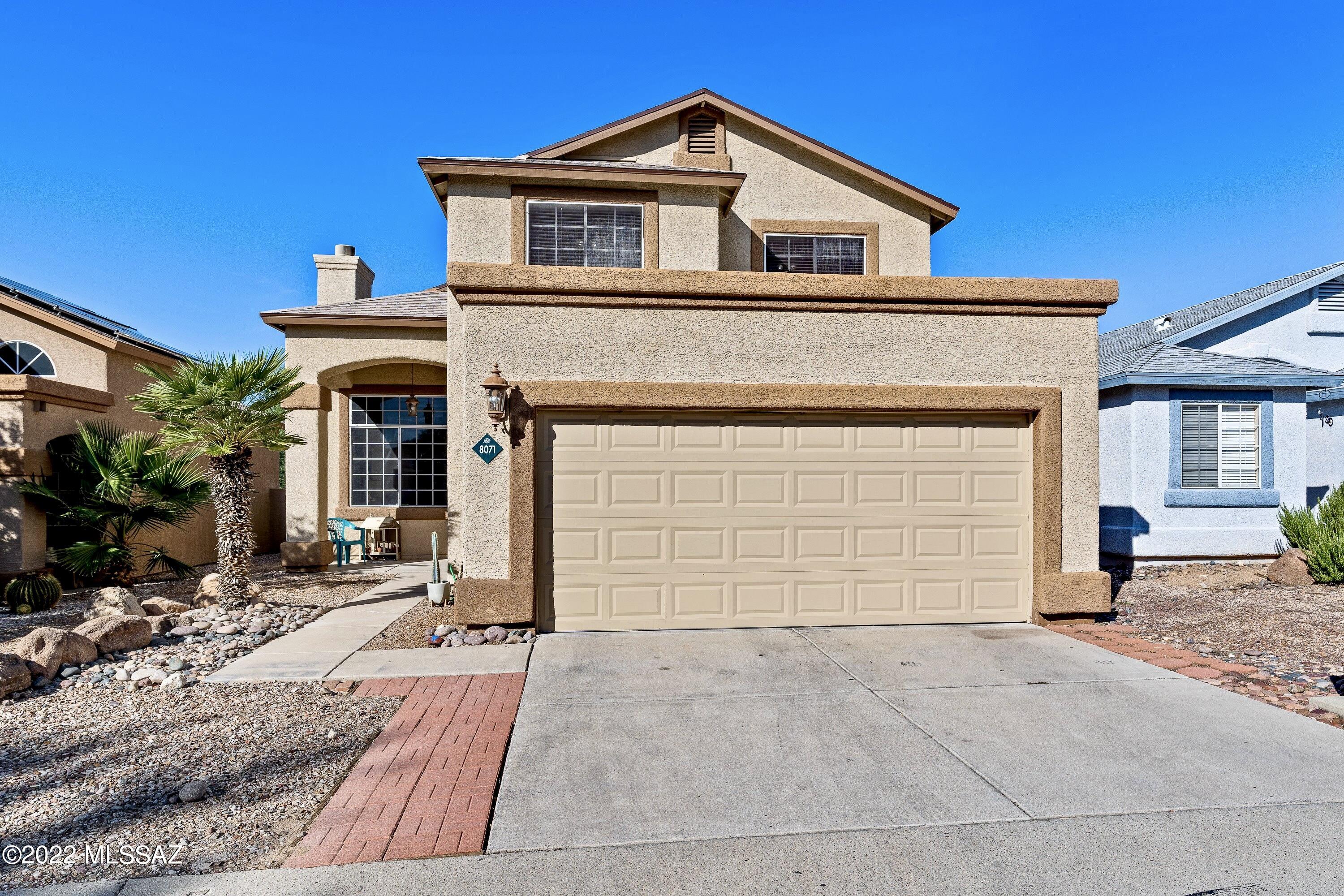 Great northwest home located in a quiet neighborhood with a community pool. Views of the Tucson Mountains and sunsets from the upper balcony. Nice floor plan; Multiple living areas, a main level bedroom & bathroom, and the laundry conveniently located on the upper level with the additional bedrooms. The main level half-bath has a niche with a shower valve in the wall, so a full bathroom on the main level could easily be added by a new owner. New roof in 2020-2021, leased solar system for low electric bills, water softener, some newer appliances, and no carpet! Updates include; New upper level wood laminate flooring, new finishes in full bathrooms, new ceiling fans, new light fixtures & new plumbing fixtures. Close to I-10 and community amenities. Great Home ~ Come see!