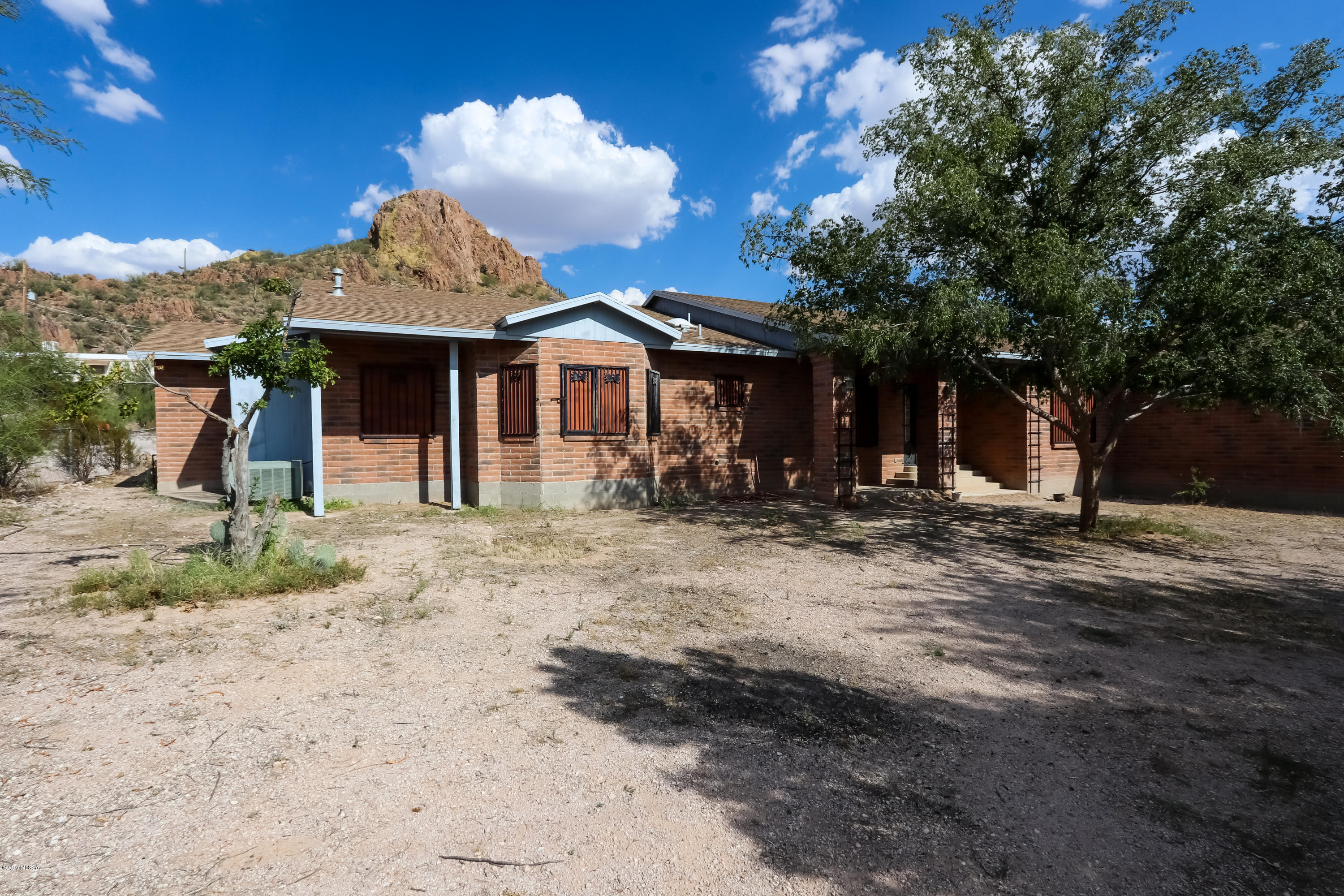 Come check out this amazing opportunity to own two parcels with over 2 acres. The main house has 4 bedrooms, 3 bathrooms and another bedroom size room with no closet. 4 of the bedrooms have doors to the exterior of the home. The kitchen has plenty of cabinet and countertop space. There is plenty of room in the 2 car garage with a little extra workshop/tool area. There is a shed adjacent to the horse pen, although there haven't been animals in some time. The manufactured home (4231 W Elvado) is 1200 square feet with 4 bedrooms and 1 baths. Country living but close to amenities!