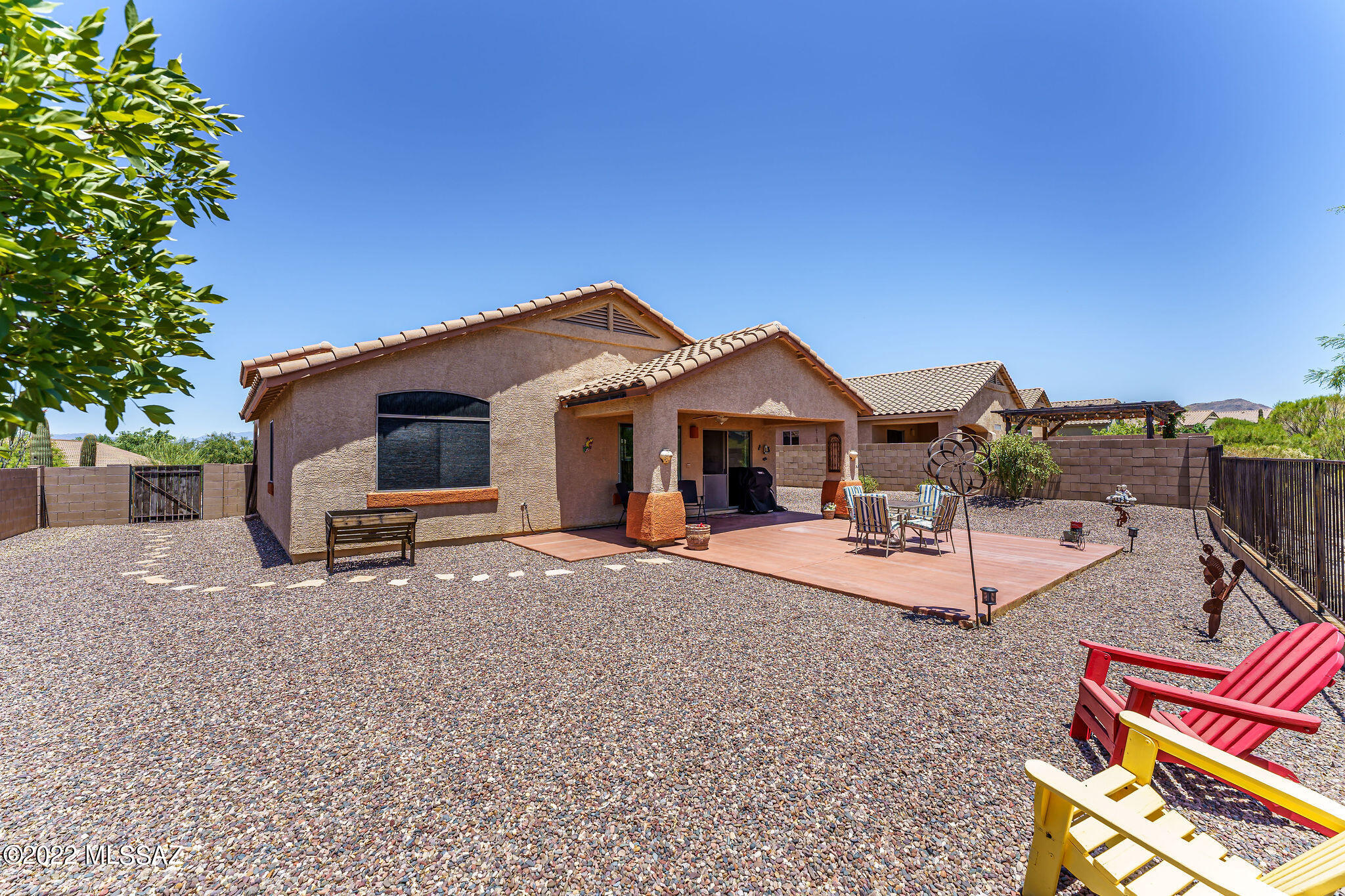 Located on one of the best lots in the subdivision with natural area behind, mountain views and an oversized backyard. 
The huge kitchen is open to the family room and has lots of cabinetry w/stainless steel hardware. You will love the island for extra cooking space and will accommodate seating for at least 4 people.  Stainless steel appliances to include a gas range, built in microwave, dw, and a side by side refrigerator with water and ice dispenser. Corian Countertops and an undermount sink.  Vaulted Ceiling, Ceilings fans throughout, Custom paint. The large Master suite has an executive height vanity w/ dual sinks and a walk in closet. Award Winning Vail Schools. The community has walking paths, gazebo, play areas, entertaining area and barbeques. Covered patio w/ceiling fan. Colored concrete patio extension creates more entertaining space. 
2 car garage. Laundry room w/ upper shelve and cabinetry.