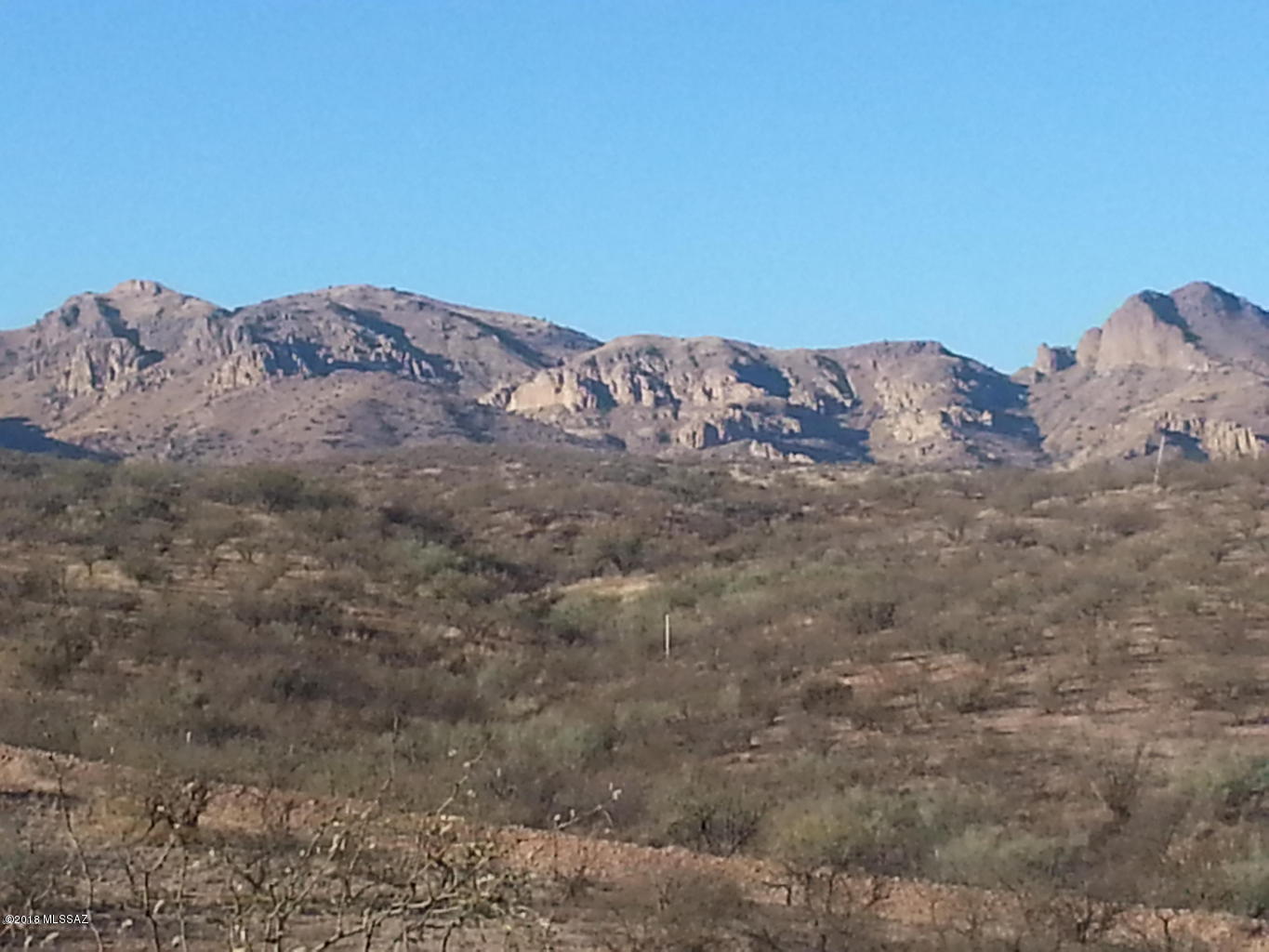 Over a half acre. Nice flat lot with views.  Easy access to Camino Josefina.  Owner will carry.