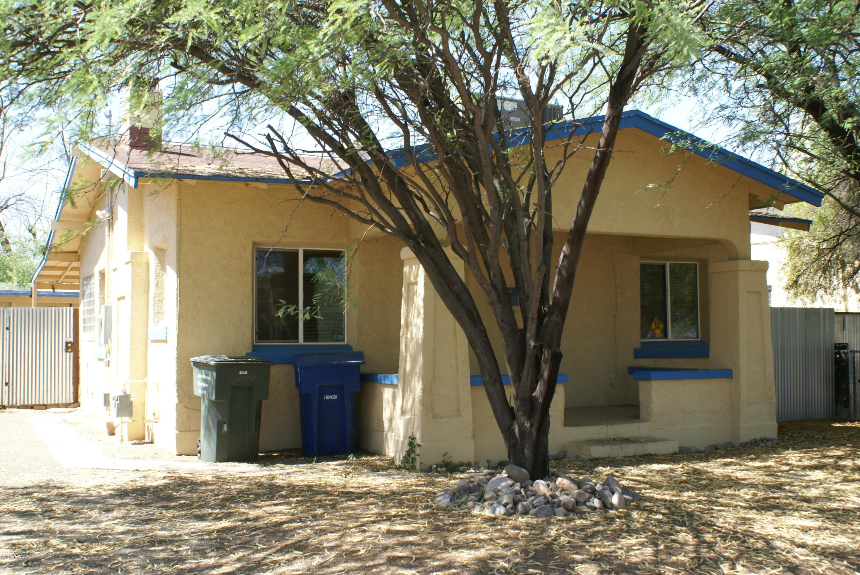 Has Tons of Character! 3 bed / 2 bath, ONLY 2 Blocks from University of Arizona. Vintage hardwood floor. Garage converted to a guest house.