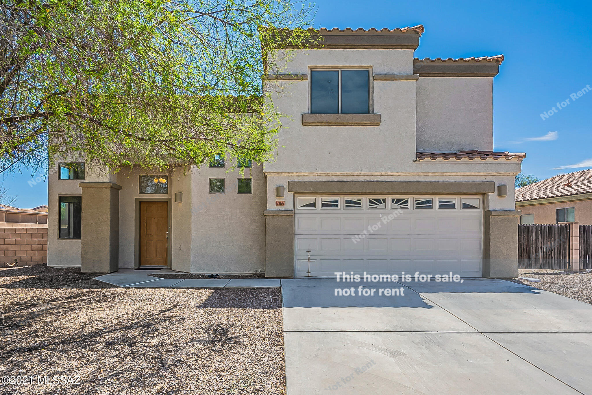 This Tucson two-story home offers a two-car garage.