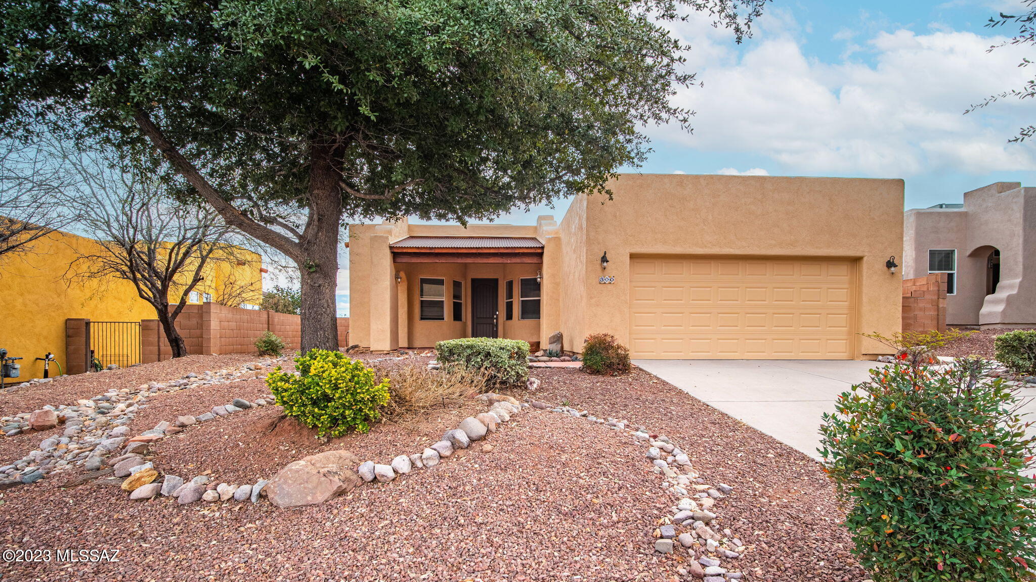 Do not miss your opportunity to see this beautiful home in Rio Rico! With a convenient location within walking distance to the a grociery tore and post office, this 3 bedroom 2 bathroom home won't last long! The neighborhood features paved sidewalks, a community pool, and BBQ area. The primary bedroom features a larger bathroom with double sinks, and the living room is open and features a convenient fireplace. If you're looking for storage the built in shelving in the garage will give you all the storage you need! This one won't last, schedule a showing today.