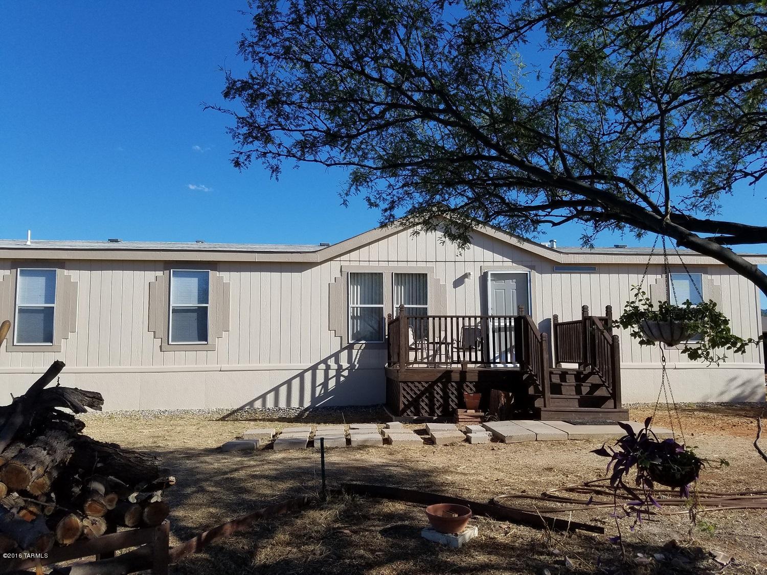 COMPLETELY REMODELED ON THE INSIDE! A MUST SEE! Kitchen includes all new appliances, beautiful back splash, tons of cabinet space and a large pantry. There is a living room and a spacious family room with built in book shelves/entertainment center. Enjoy the amazing mountain views outside on your new wood deck. On this 1 acre lot there is RV space available and horses are allowed. Also included is an extra fridge in the laundry room next to your new washer and dryer. Come and take a look before this beauty is gone!