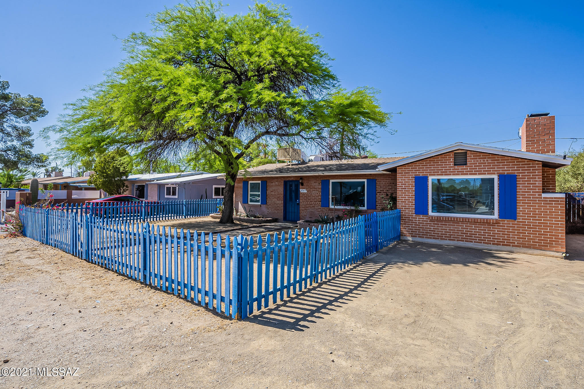 Charming 2 bedroom, 2 bath central home close to U of A and downtown. Spacious living room and family room with fireplace and dining area. Breakfast nook in the large kitchen with cabinets to the ceiling. Expansive bathroom off master with a gorgeous claw foot soaking tub. Master bedroom has a huge walk-in closet. Laundry room includes a hobby/office space. Backyard with covered patio and space to create your own private oasis; includes storage shed, and north facing view of the mountains. Make this home your own by adding your finishing decorative touches.