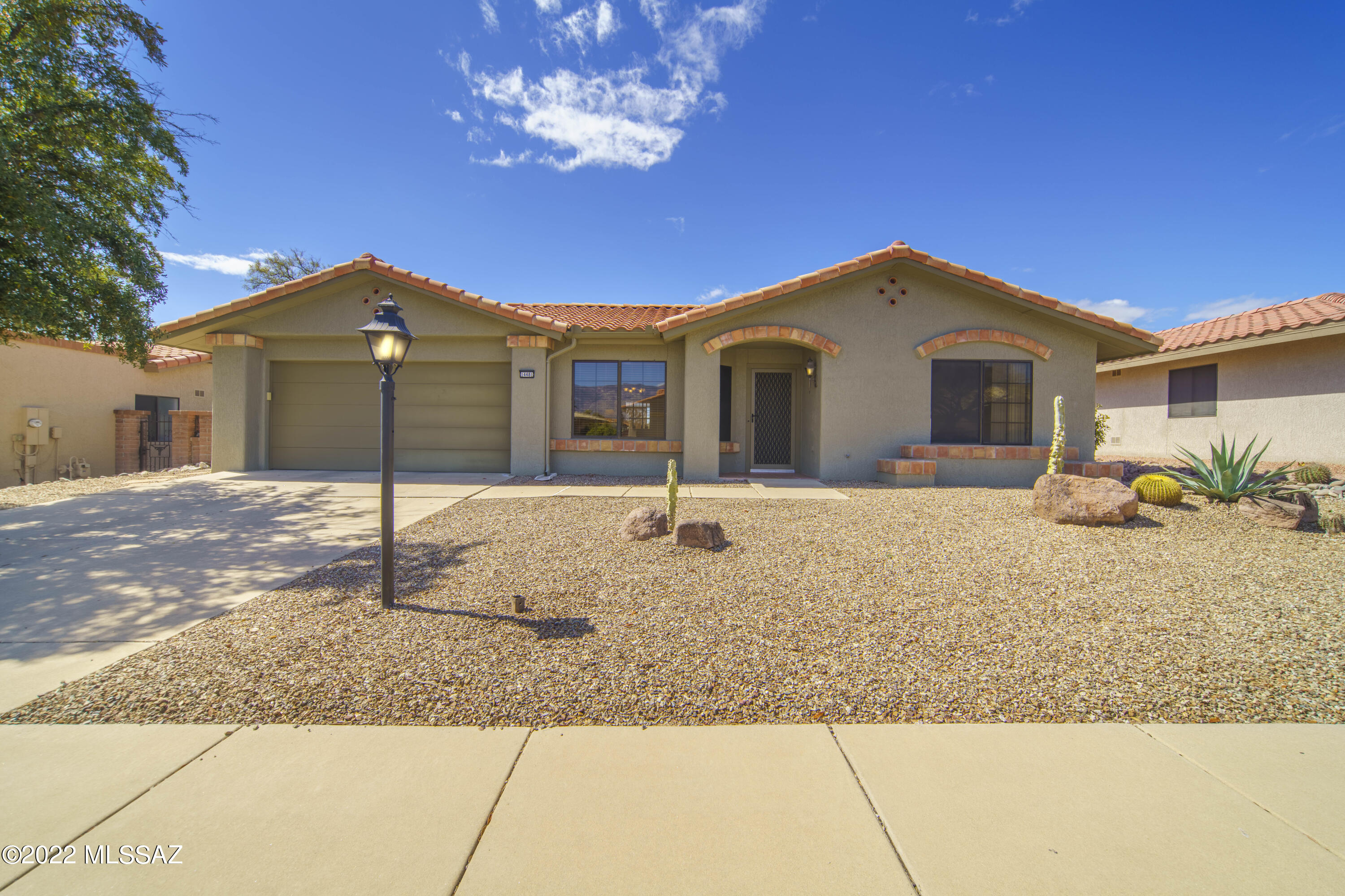 Welcome to this beautiful bright home in Sun City Oro Valley. In addition to the standard 2 bedroom, 2 bathroom set up of this community this house has a lovely office with build ins and a desk that faces straight into the beautiful backyard. 

This open spacious yard is surrounded by a well maintained fence and faces directly into an open desert area for resident hiking. Enjoy your view from the fully screened in Arizona Room with beige suntex material to keep you cool outside in the summer.

From the living room you have incredible views of Catalina Mountain tops. Enjoy the sunset from the comfort of your couch, watching these incredible mountains turn fabulous colors almost every night! 

The master bath boasts a remodeled shower with travertine stone that is a must see!