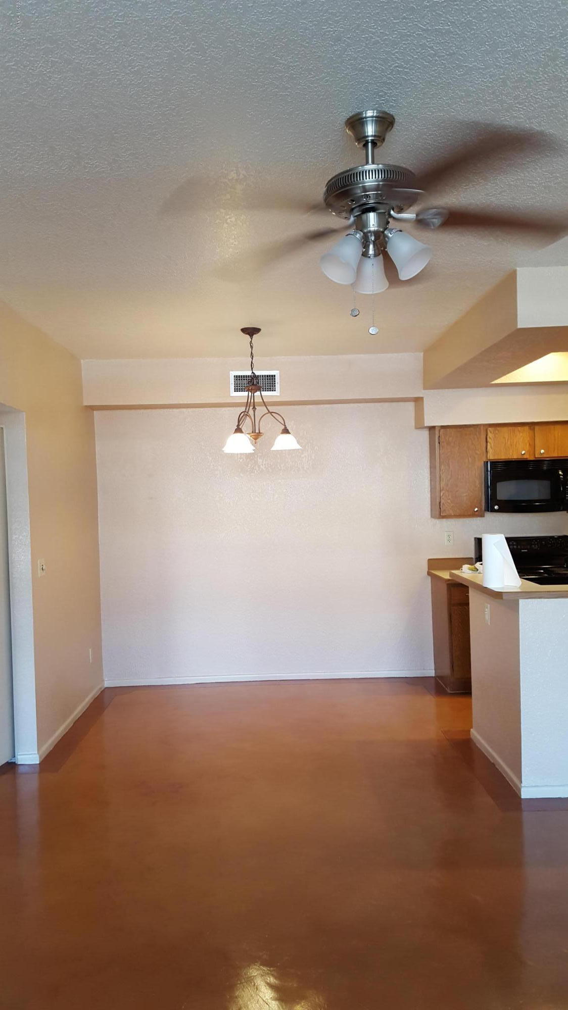 Well maintained and updated with beautiful concrete floors.  Original owner. 2 BD 2 BTH.  Two way fireplace between great room and den.Separate dining along with eat-in kitchen.  High cielings. Brick patio. clean clean clean...