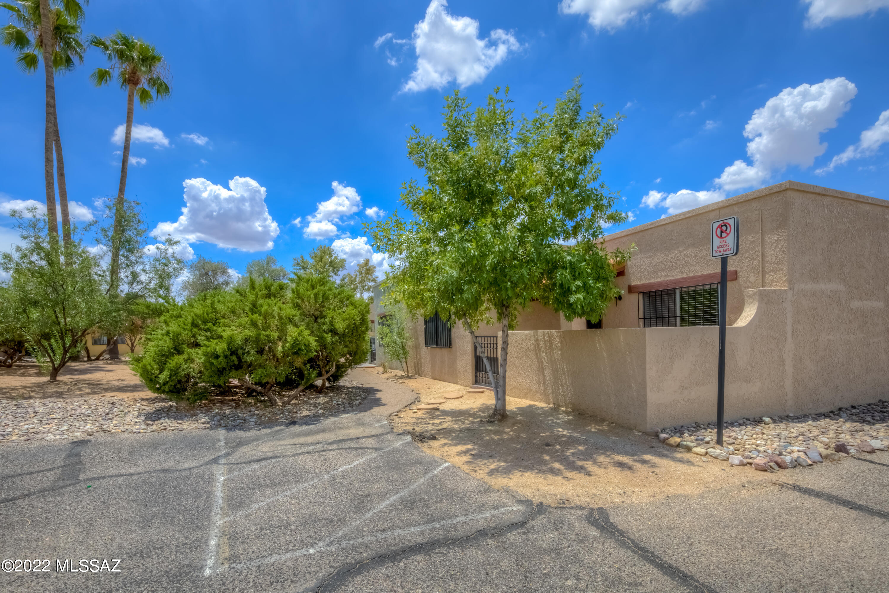 Beautifully Remodeled East-Side Townhome! Home offers open Family Room with high ceilings, new plank wood-style flooring, new carpet in bedrooms, fresh interior paint, new 2'' blinds throughout, updated Guest Bathroom, storage room with laundry, and much more. Open Kitchen has stylish counters, updated cabinets, and new stainless appliances. Breakfast/Dining area just off the kitchen. Spacious Master Bedroom with double closets and updated bathroom. Covered back patio has brick extension and bonus storage area. Refreshing community pool and convenient east-side location.