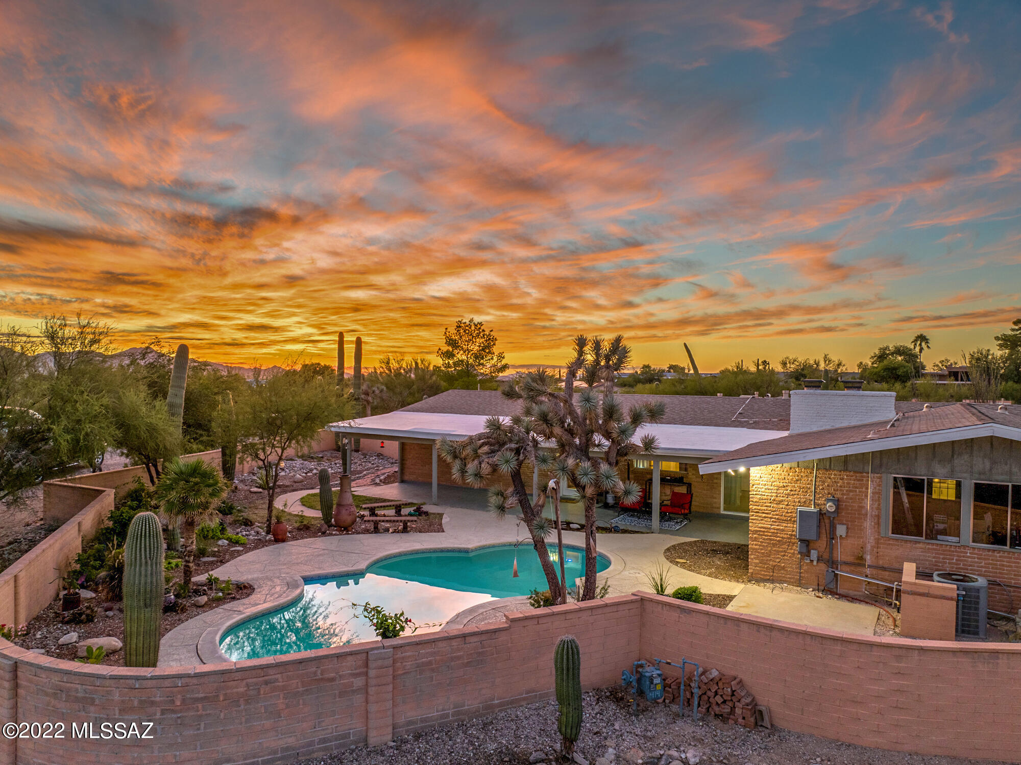 This beautiful brick home in the Catalina Foothills is truly a gem! Located at the top of the city within District 16 schools this 4 bedroom 2 bathroom home checks all the boxes. You will enjoy both city and mountain views from the huge covered patio in your beautifully landscaped backyard with flowering plants to attract butterflies and hummingbirds. Relax in the refreshing pool during the hot Tucson summers. The home has been updated with wood look ceramic tile, updated lighting and stainless steel appliances. Don't miss your opportunity, schedule your private showing today.