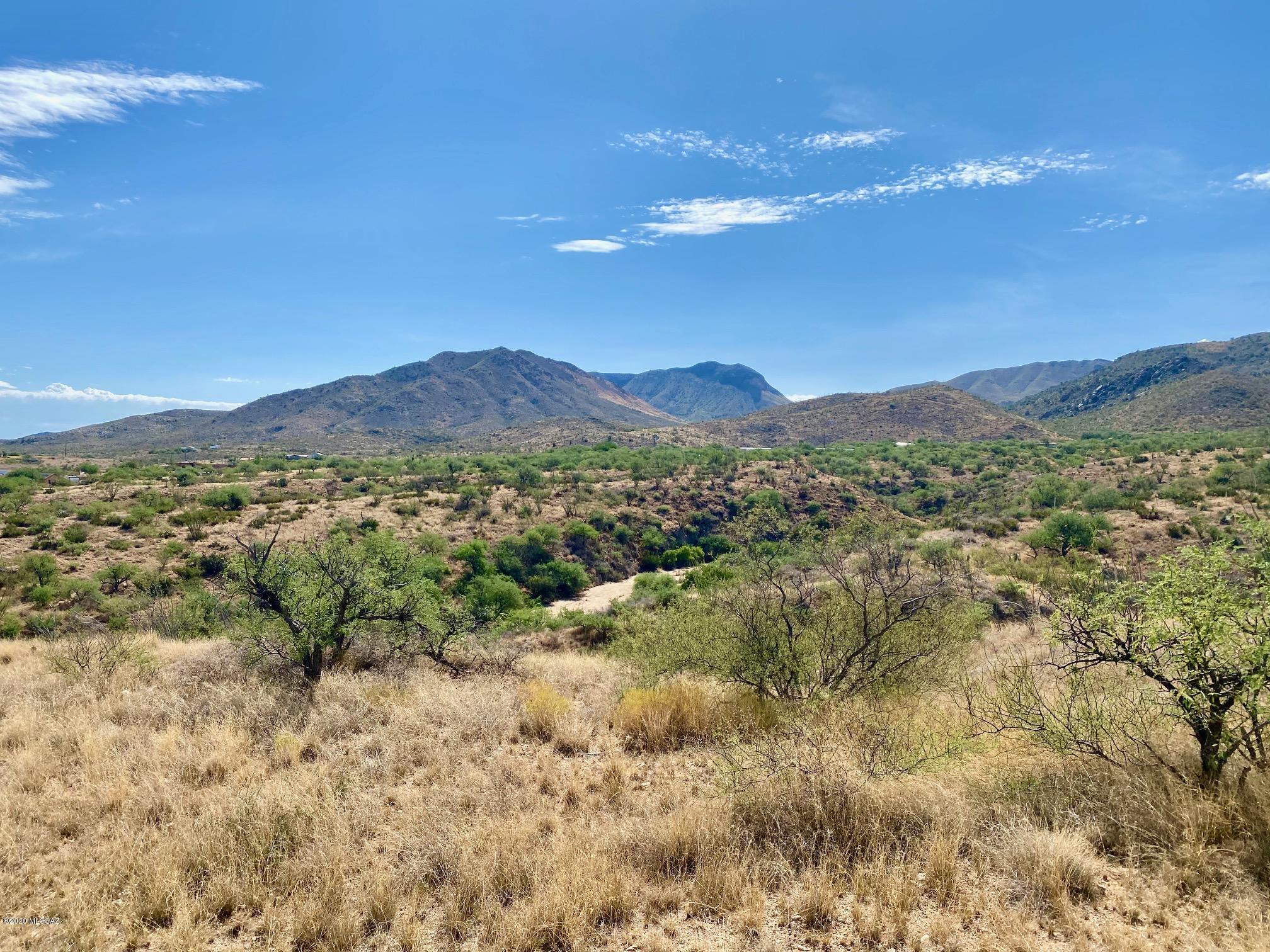 Beautiful and private 9.53-acre lot ready for your dream home with room to roam! These breath-taking panoramic views of the Santa Rita mountains, Charron Vineyards, Sonoran desert, and awe-inspiring Arizona sunsets are within minutes of horseback riding, 4-wheeling and fishing on nearby state & BLM lands. Quick interstate access via Hwy 83 is minutes from hiking, biking, shopping, golf and amenities all within the award-winning Vail School District. Electricity, telephone and water (2/7 of shared well) are at lot line and ready to go! Investors, please note lot may be divided into 2 parcels with separate well shares, but current deed restrictions do not allow manufactured homes. DON'T MISS THIS DESERT GEM!