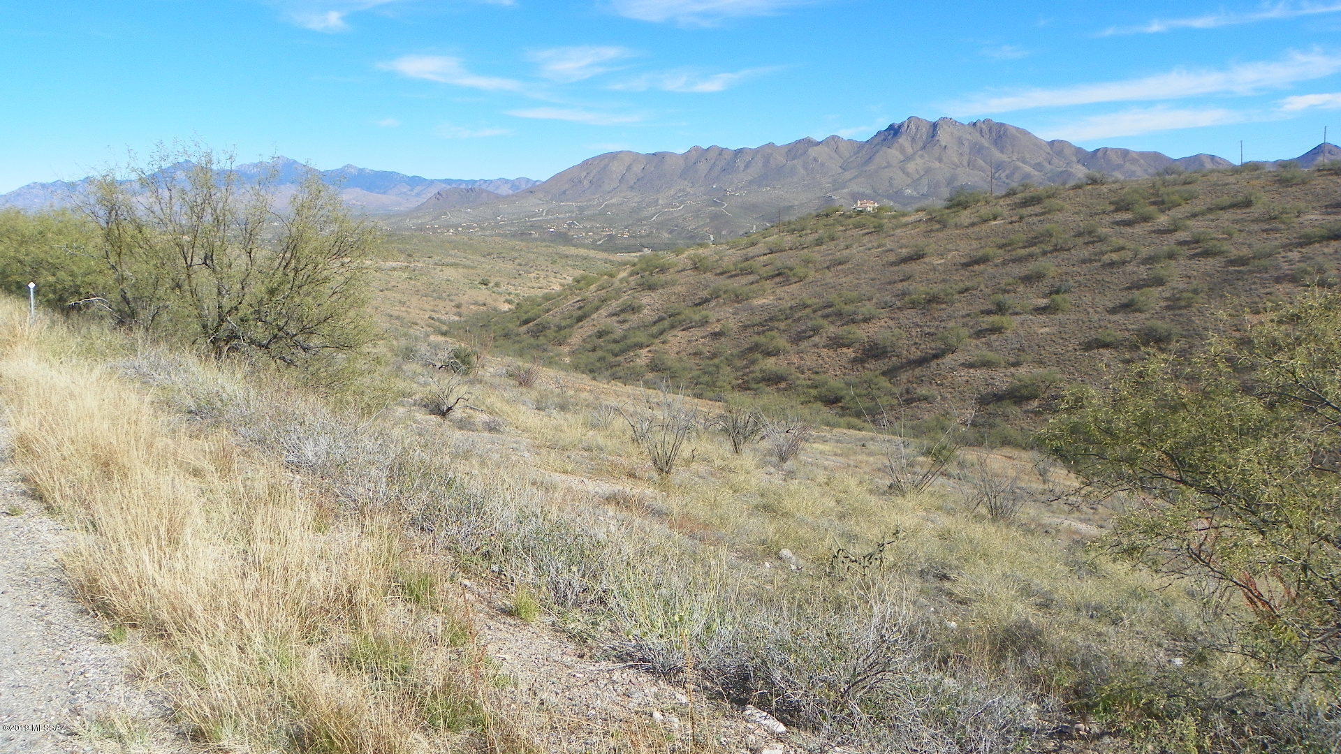 Residental lot at the North West corner of Rio Rico.  Very quiet location.  Electric and water at the street but verify the water during inspection period.  Just build a building pad and construct a home with terrific views.