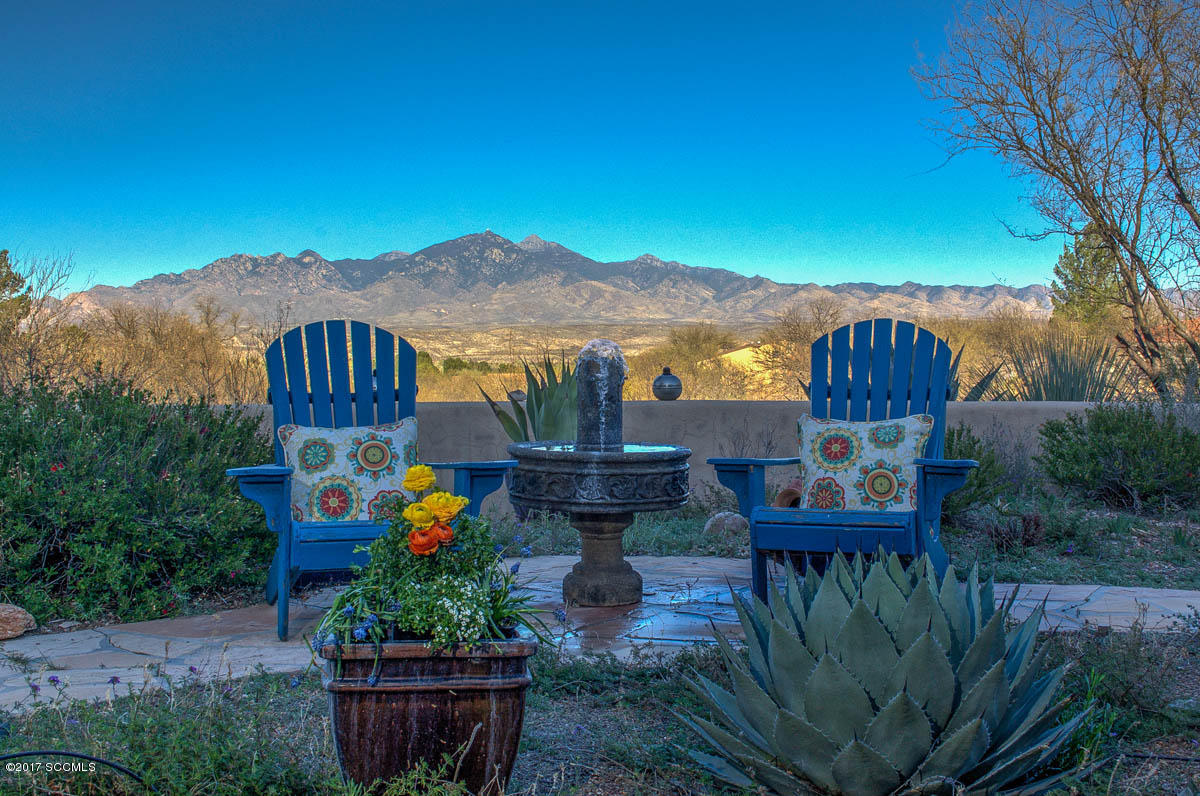 Feels private & secluded yet is less than 5 minutes to Tubac. Hand-crafted mantle in dining room. Hand-crafted guest room wall bed conveys with home. 3rd bedroom currently functions as a den with door to back patio. Built-in shelves in 3rd bedroom. Adjacent separate vacant 1.2 acre lot (112-12-015) included in price of residence and conveys with house. 3rd garage is spacious work shop. Property is offered for sale, As Is. Lot taxes $618.08.