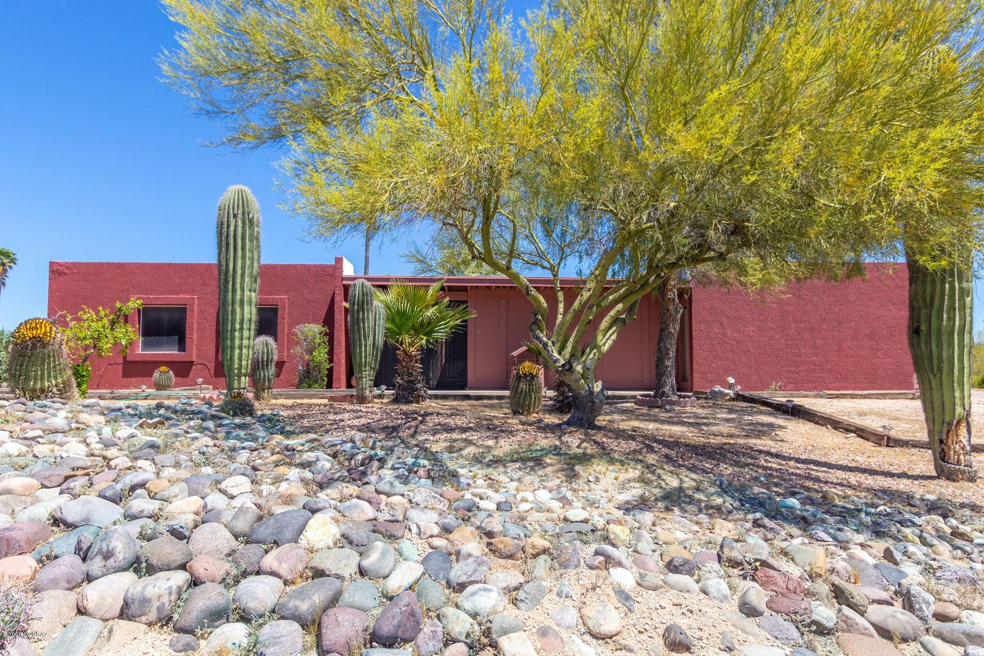 Incredibly charming territorial style home available on 1.33 acres of property in Casas Adobes Estates. Privacy, tranquility and breathtaking mountain views await you in this 3 bedroom, 2 bathroom gem. Flowing floor-plan offers a spacious living area as well as a separate open concept family room. Inviting kitchen boasts tile counter-tops, ss appliances and a breakfast bar. Master retreat includes a private en-suite. The huge backyard is very secluded and offers a covered patio, breathtaking mountain views and a private pool and spa. Excellent northwest Tucson location, near the I-10 and within very easy reach of downtown and the UofA. This is the one you have been searching for. See it today.