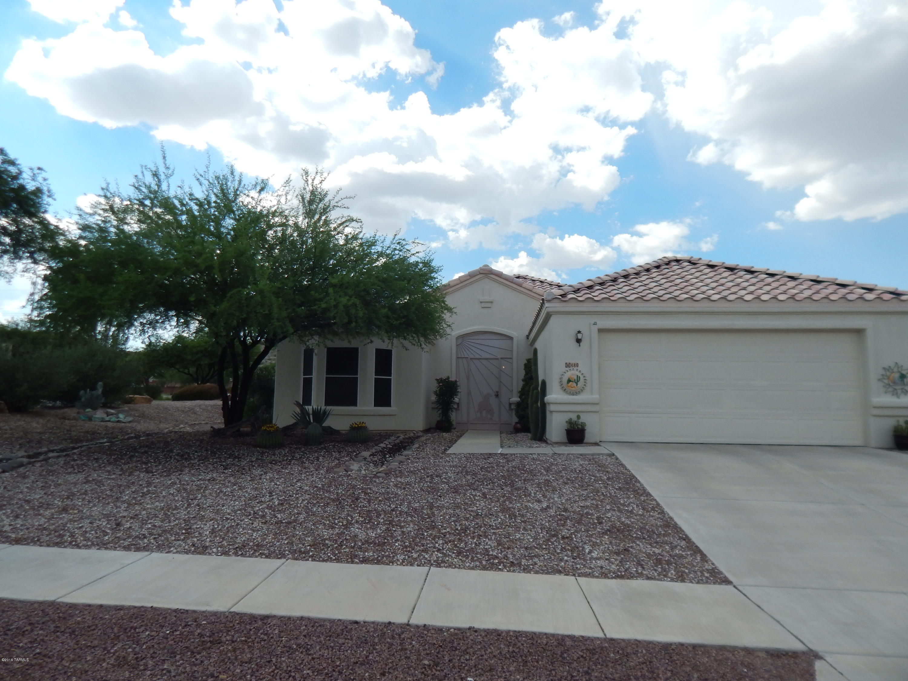 Desert Oasis! Missing the Green?
This large corner lot is lush with fruit trees, flowering shrubs, and a large raised garden. Screened AZ room affords beautiful sunsets, while the covered patio and yard has plenty of space for entertaining. Gas cooking and plenty of cabinetry in the kitchen with center island, has a pass through, eat-in breakfast are and bar. Close to shopping with front Mountain Views and privacy.